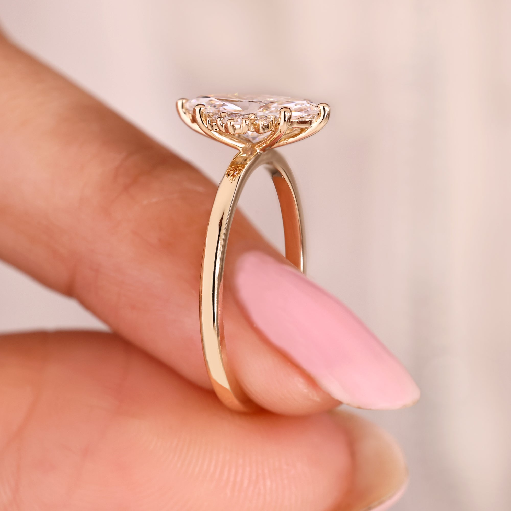 Lab grown marquise diamond ring with six prong setting.
