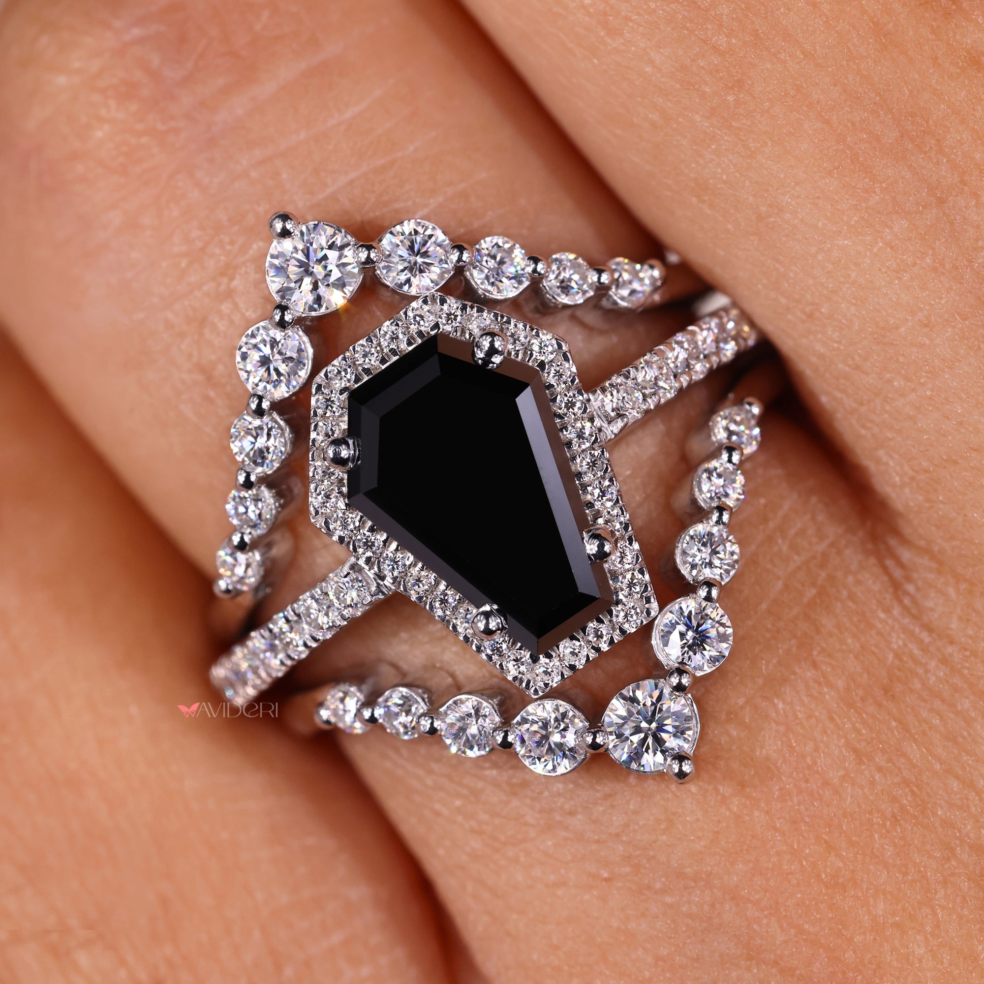 Halo ring ring set with a coffin engagement ring for added brilliance.