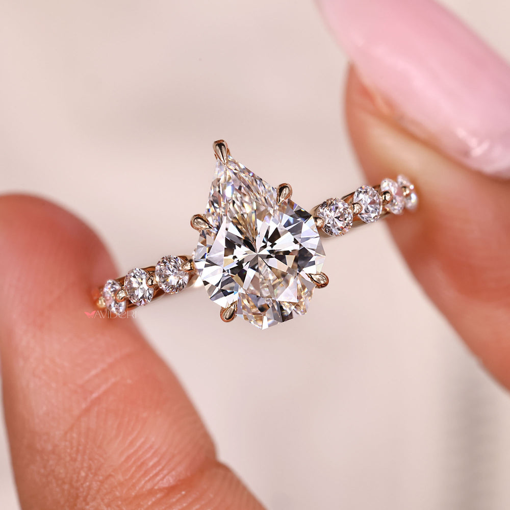 5 claw prong ring holding a pear cut diamond.