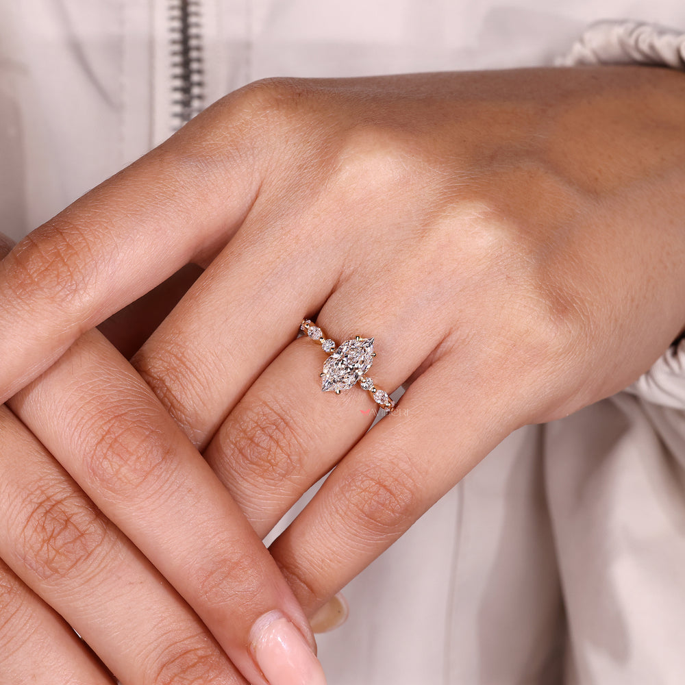 Dutch marquise diamond ring with shared prong setting.
