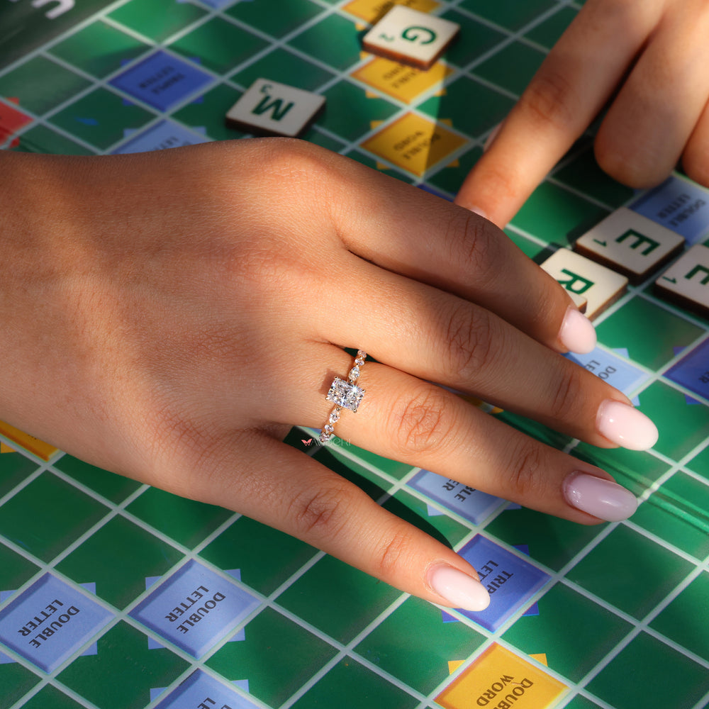 Pave ring diamond setting with radiant cut and shared prong ring.
