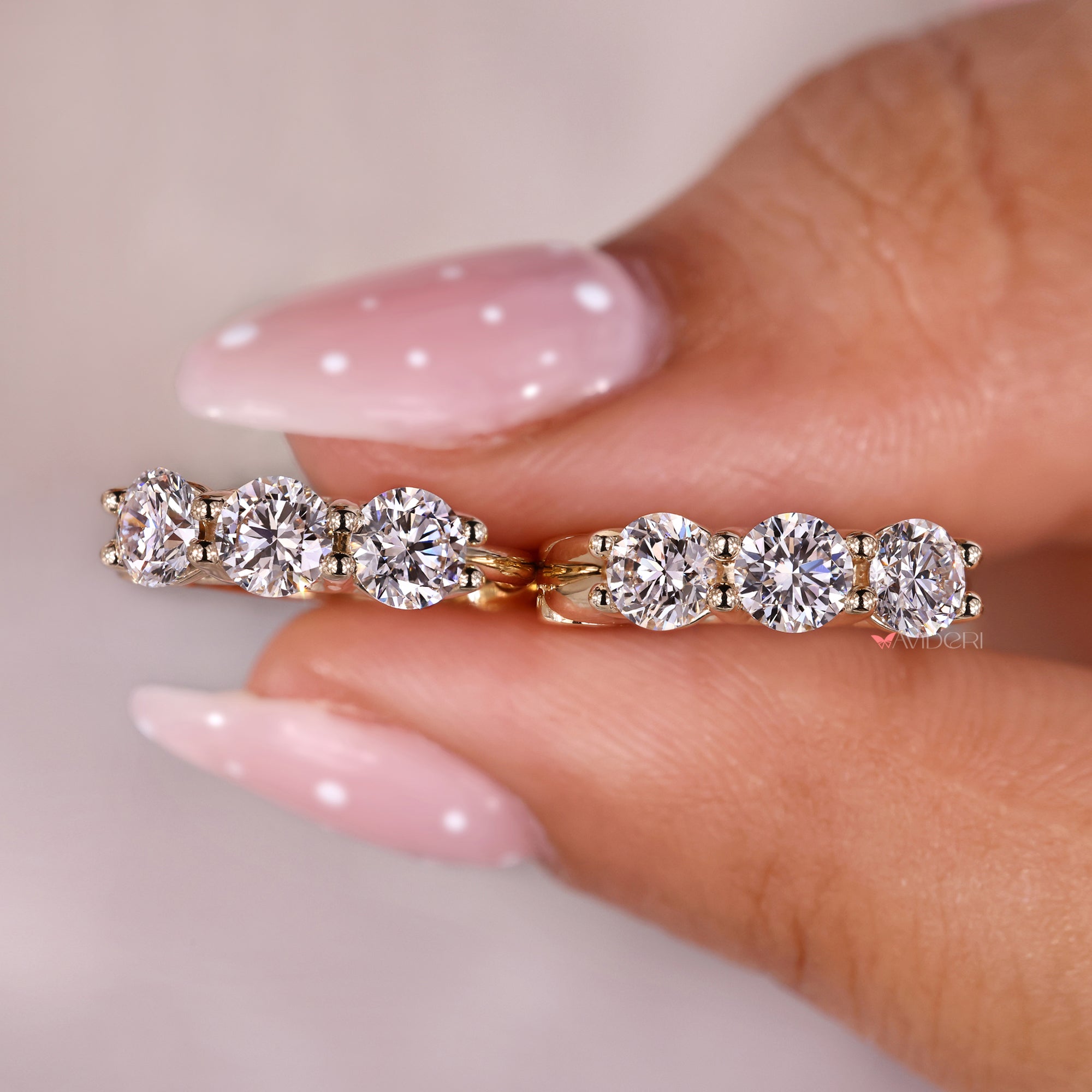 Round cut diamond earrings with avideri earrings.
