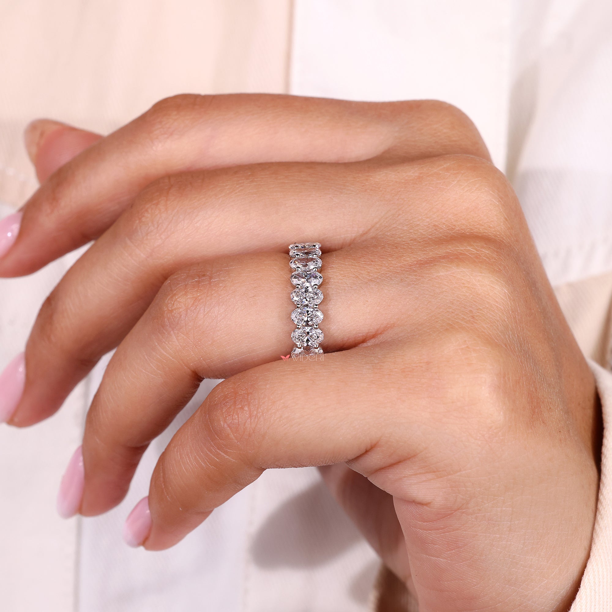 Unique wedding band with oval diamonds.