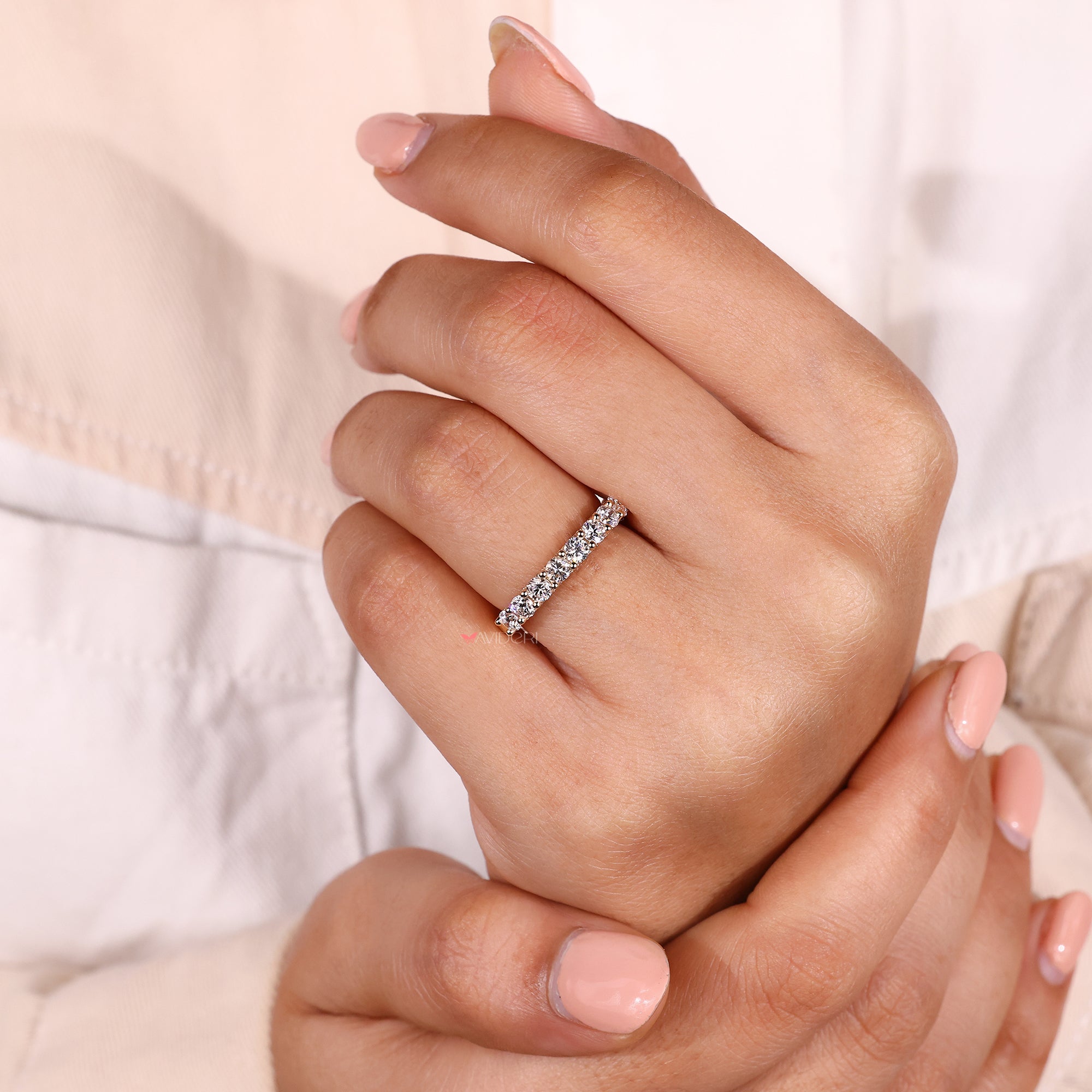 Avideri round cut diamond wedding band.