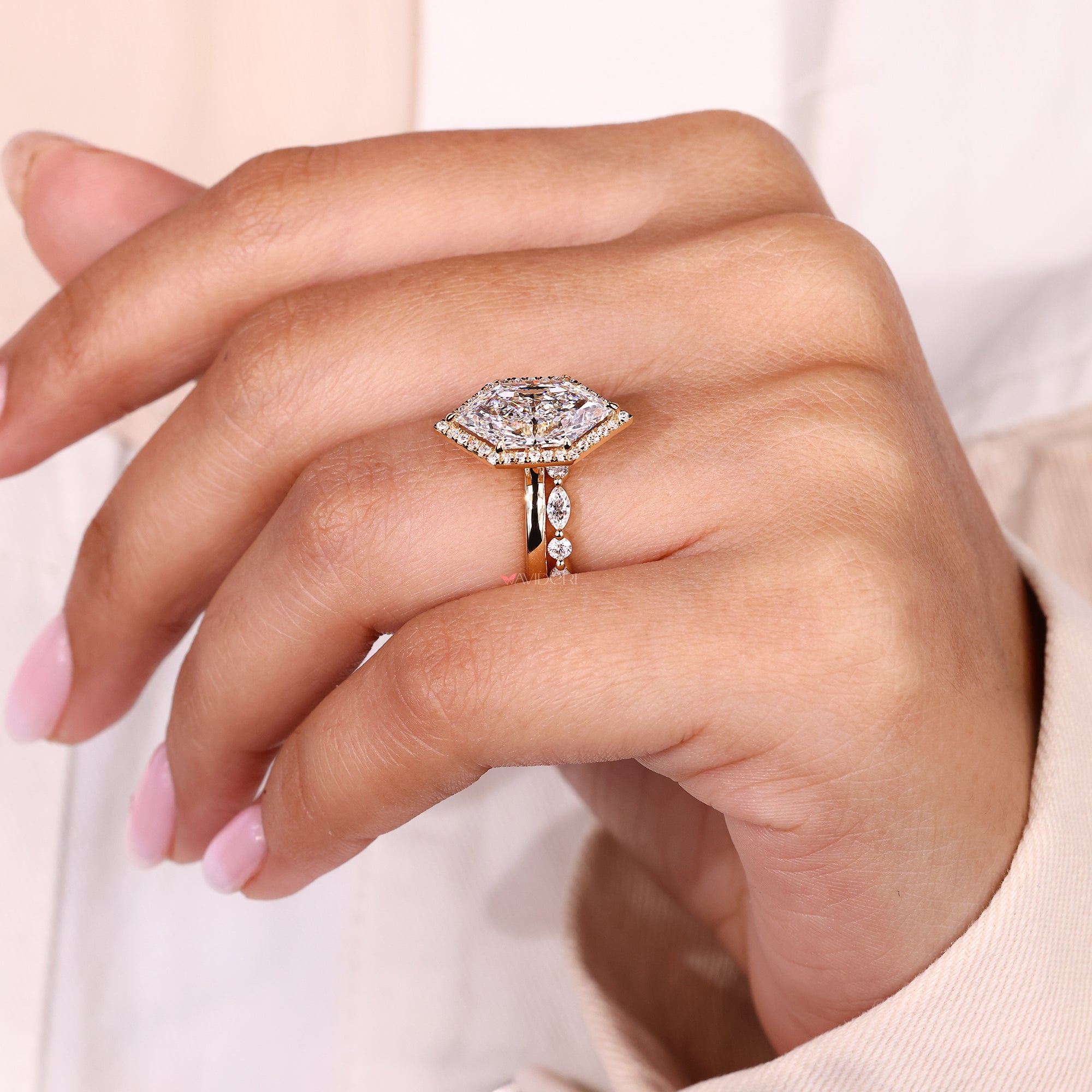 Halo engagement ring with marquise center.