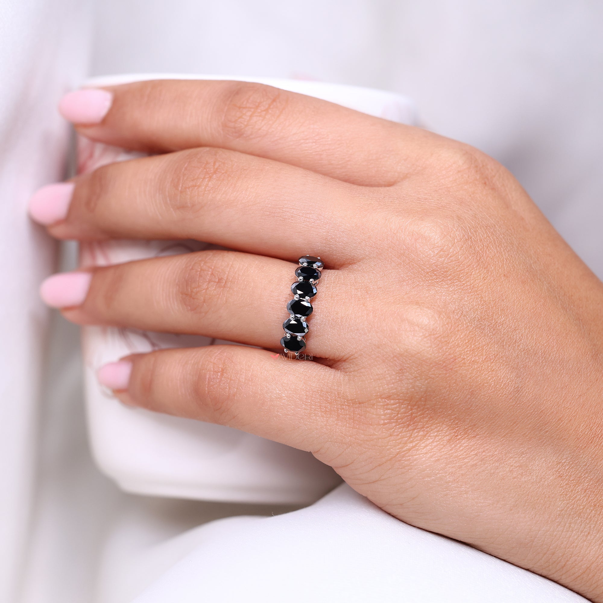 Half eternity wedding band with black moissanite wedding band.
