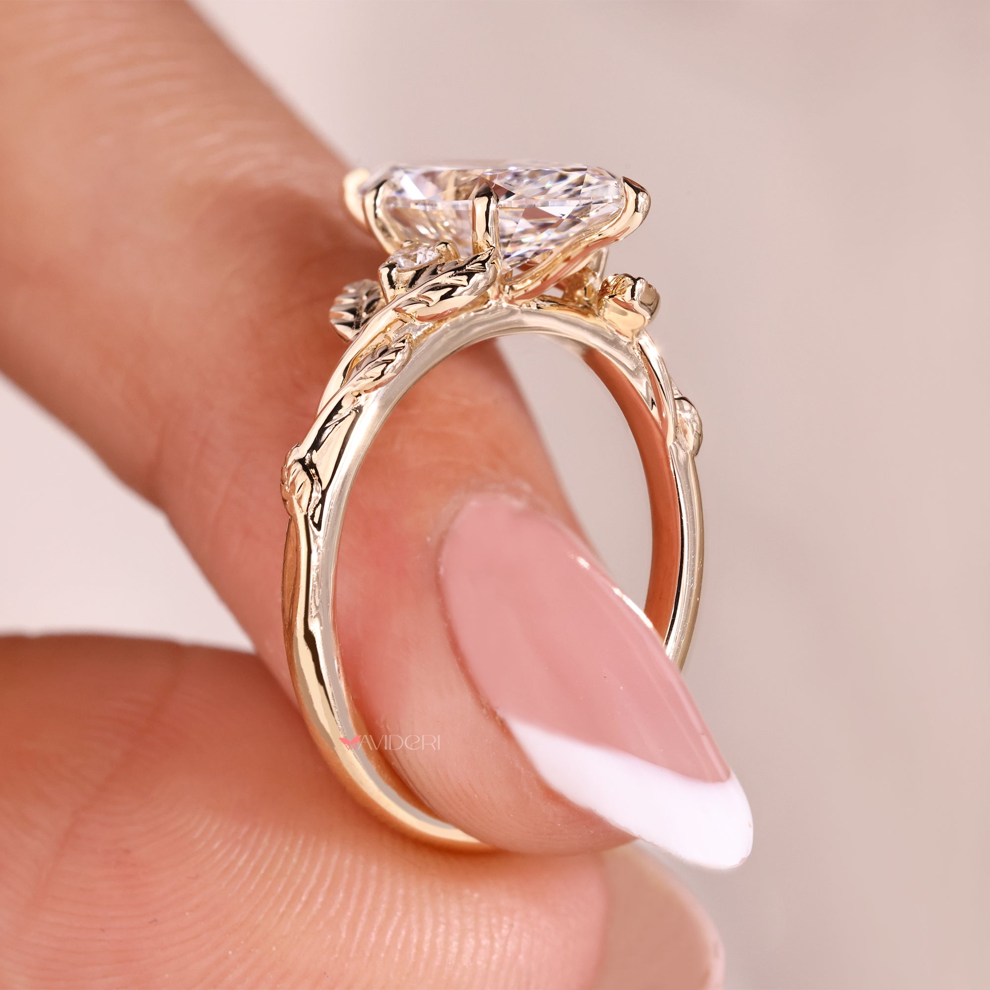 Round cut side stone ring in 6 claw prong setting.