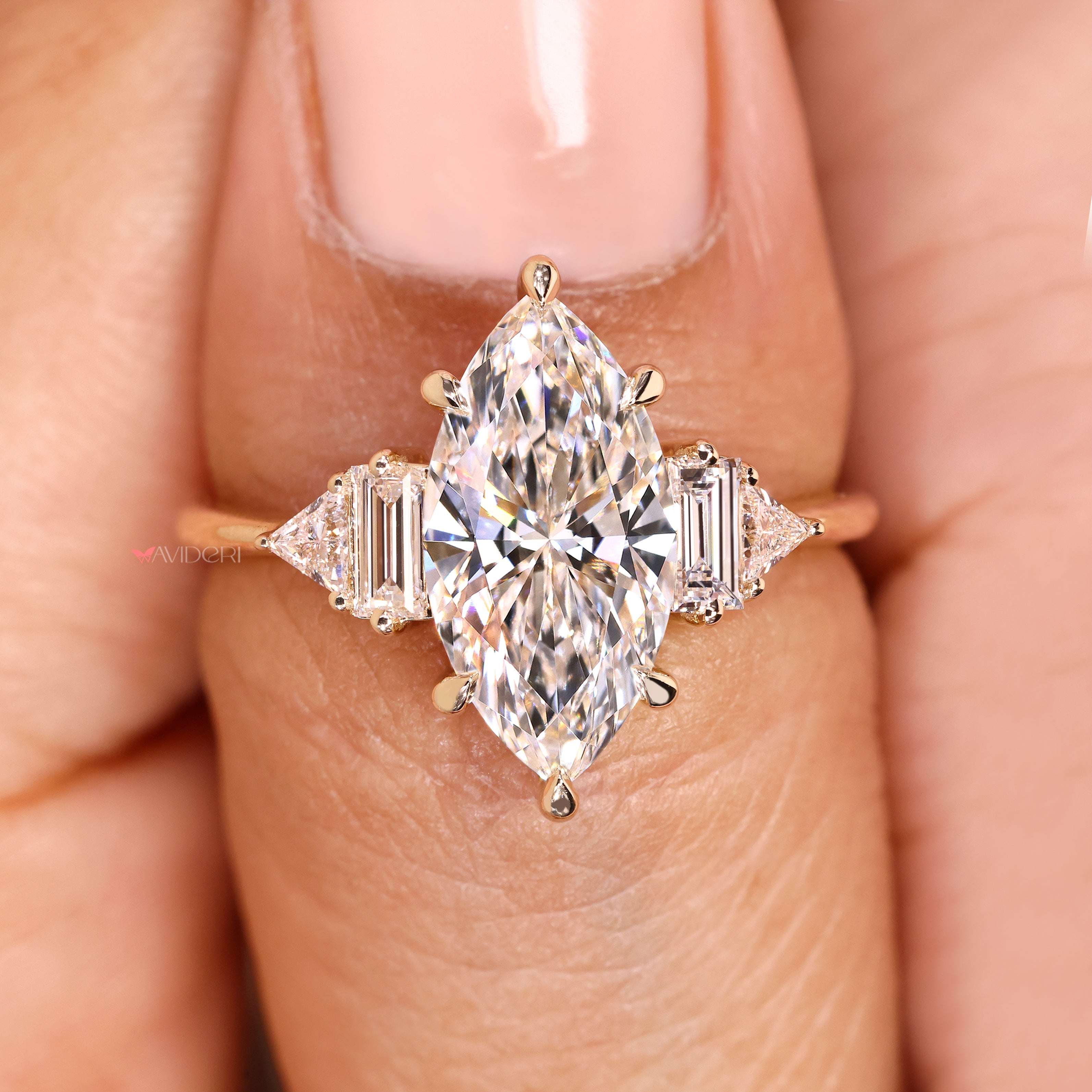 Marquise lab diamond ring with basket and claw setting.
