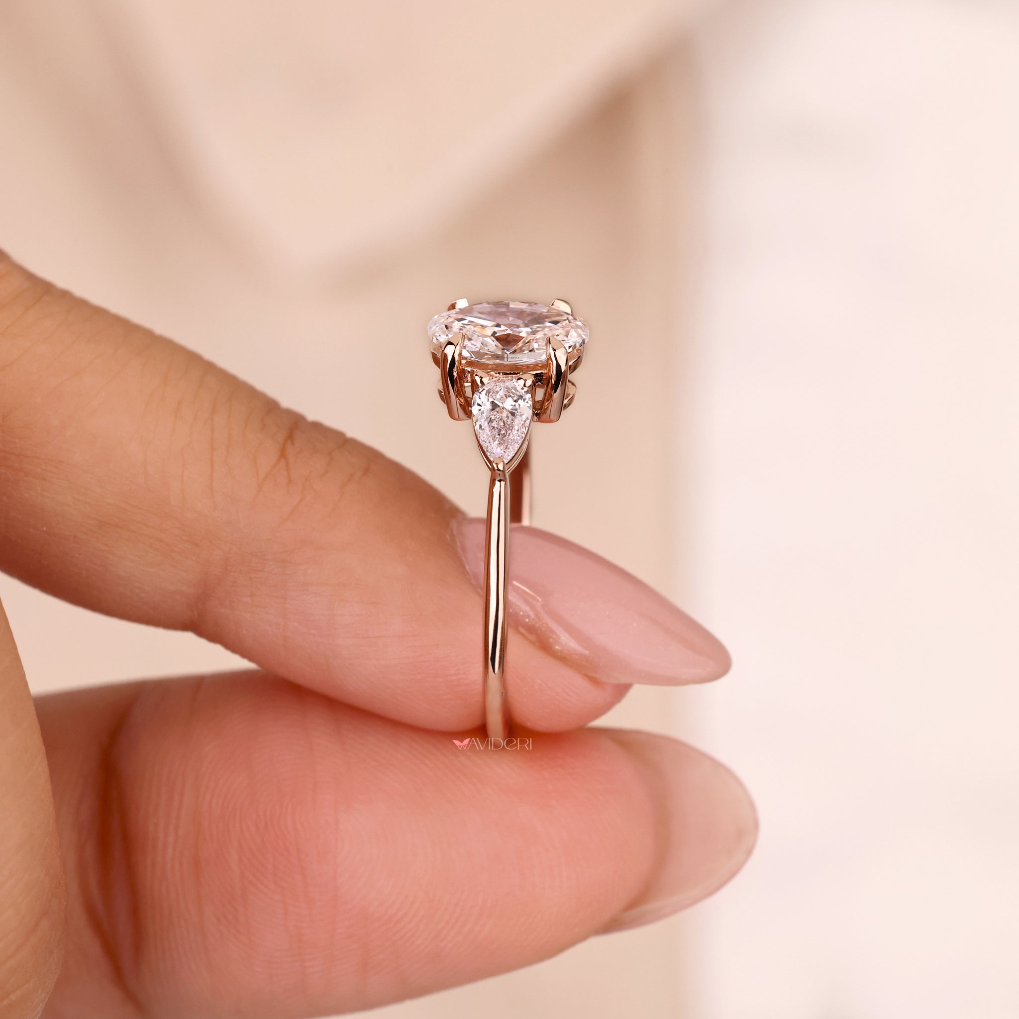 pear ring, three stone diamond ring, avideri ring
