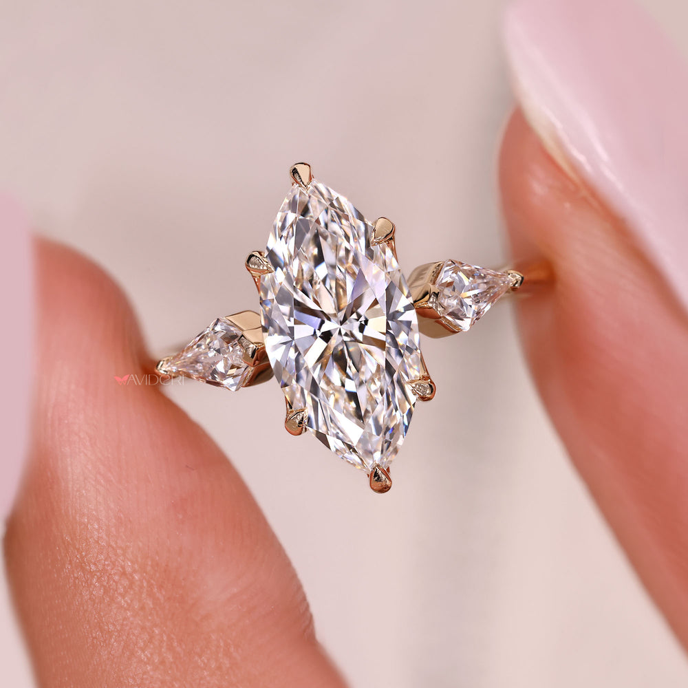 Marquise cut diamond ring with kite cut side stones.