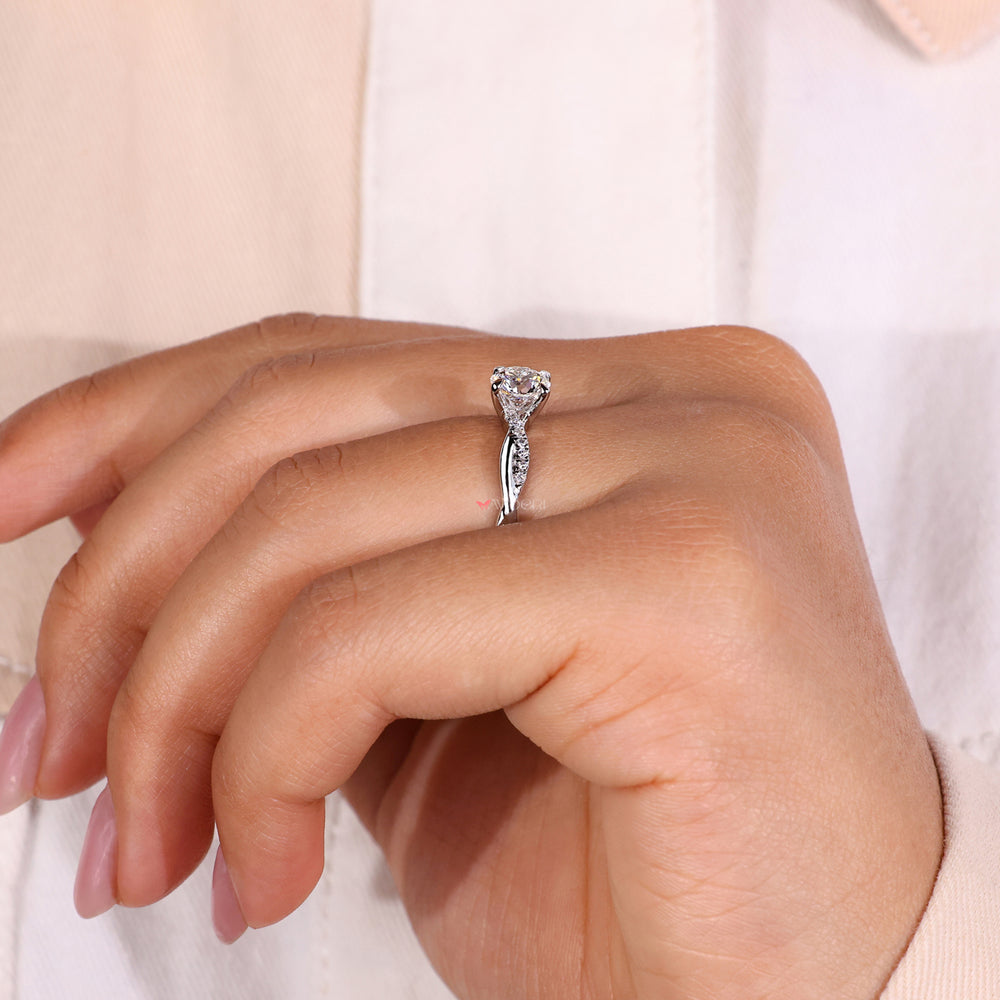 Handmade ring with a twisted band showcasing ethical IGI-certified diamonds.
