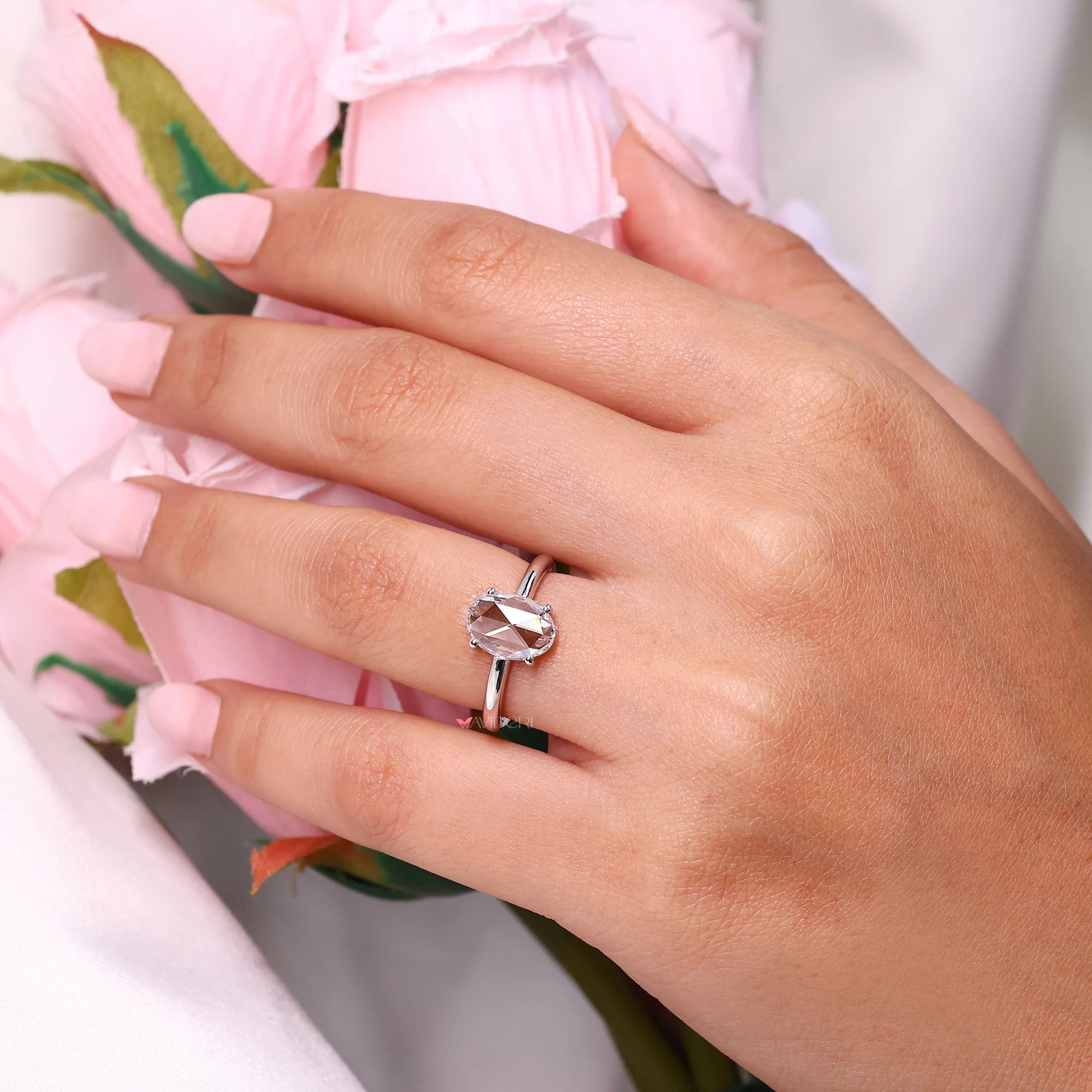 Solitaire diamond engagement ring with 4 prong setting.