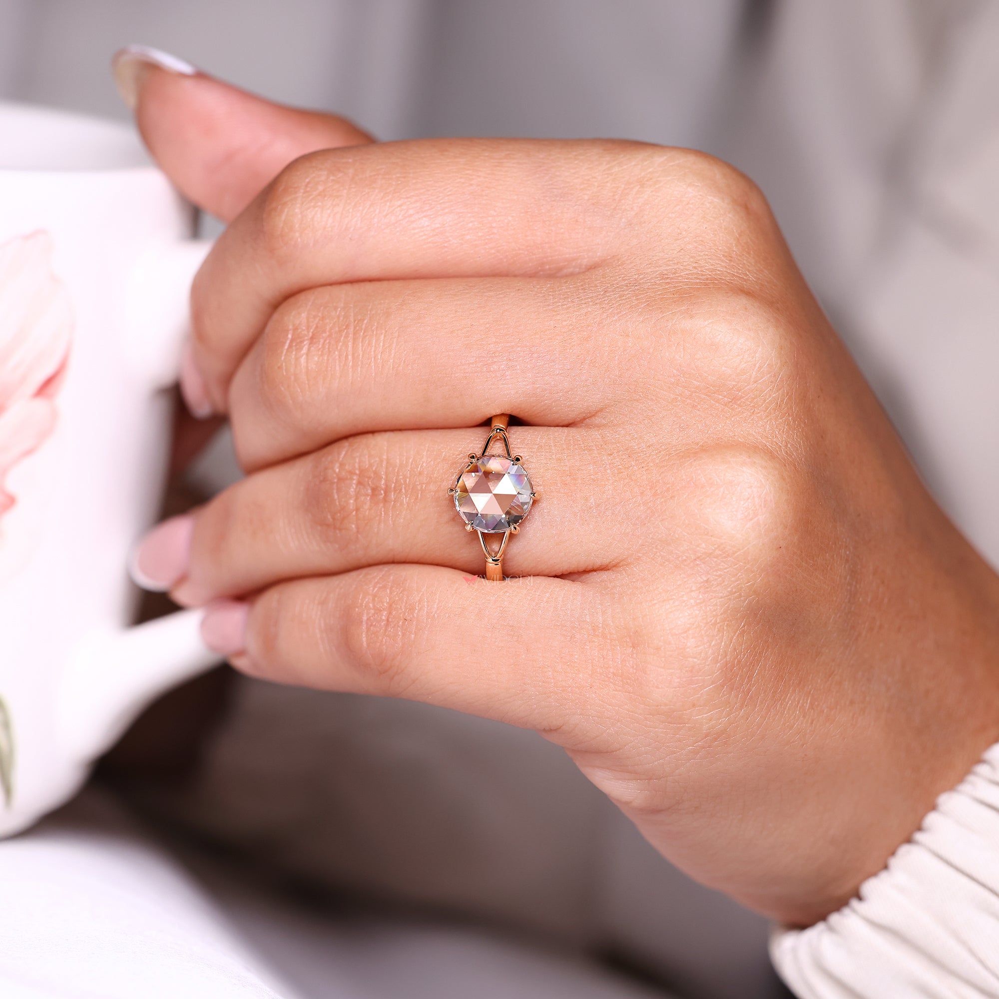 Round rose cut diamond ring in split shank diamond ring.