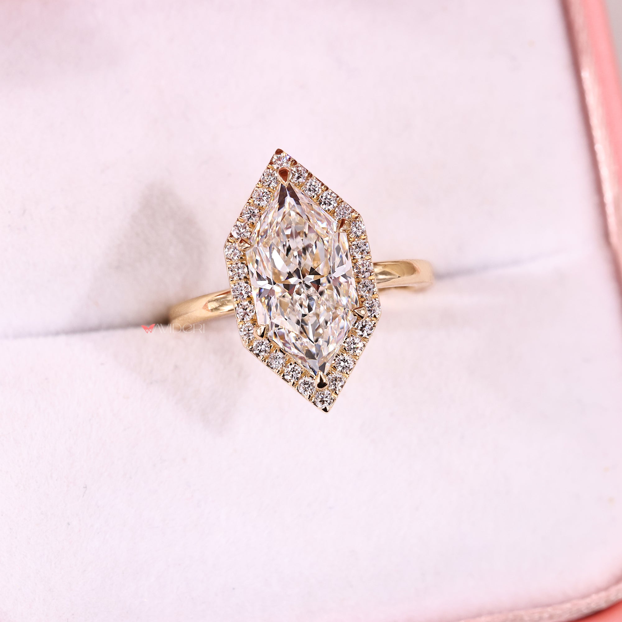 Six claw prong ring with round cut halo setting.