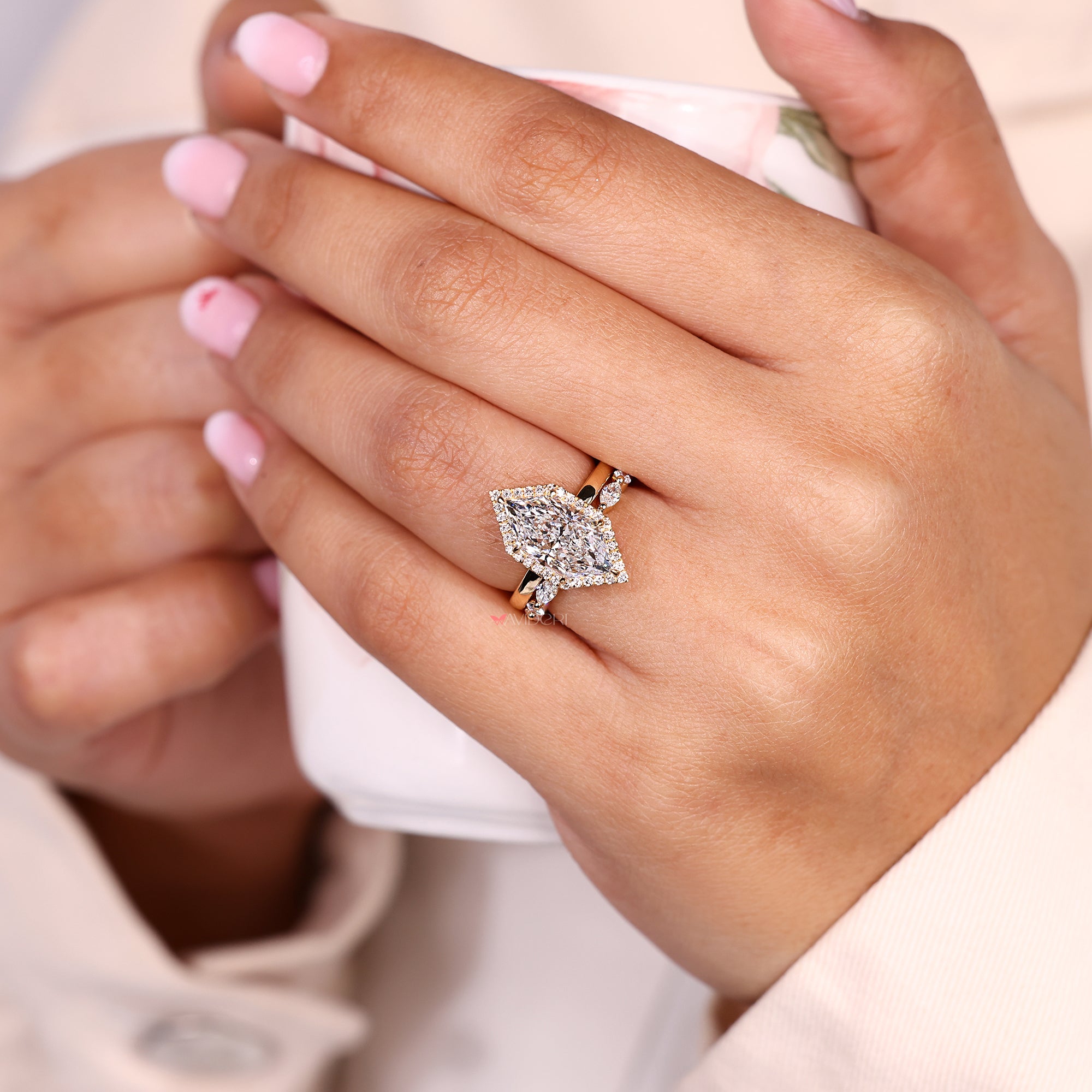 Dutch marquise ring with halo setting.