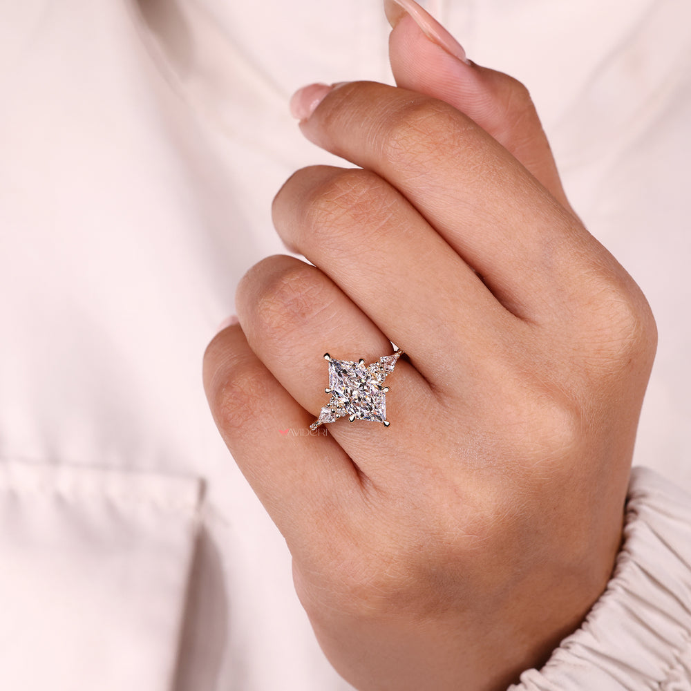 Twisted shank vintage marquise moissanite halo ring.
