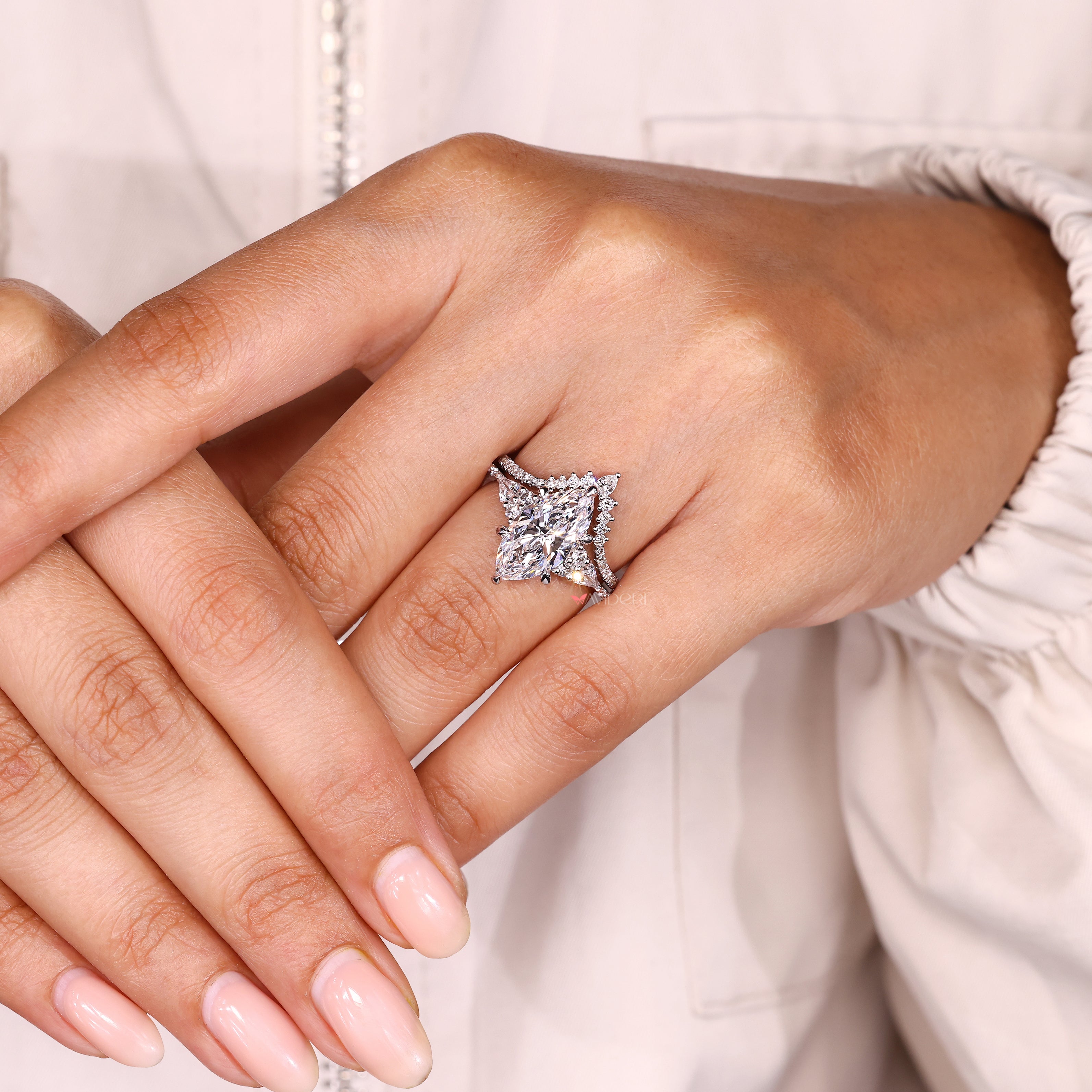 Handmade marquise engagement ring with band.
