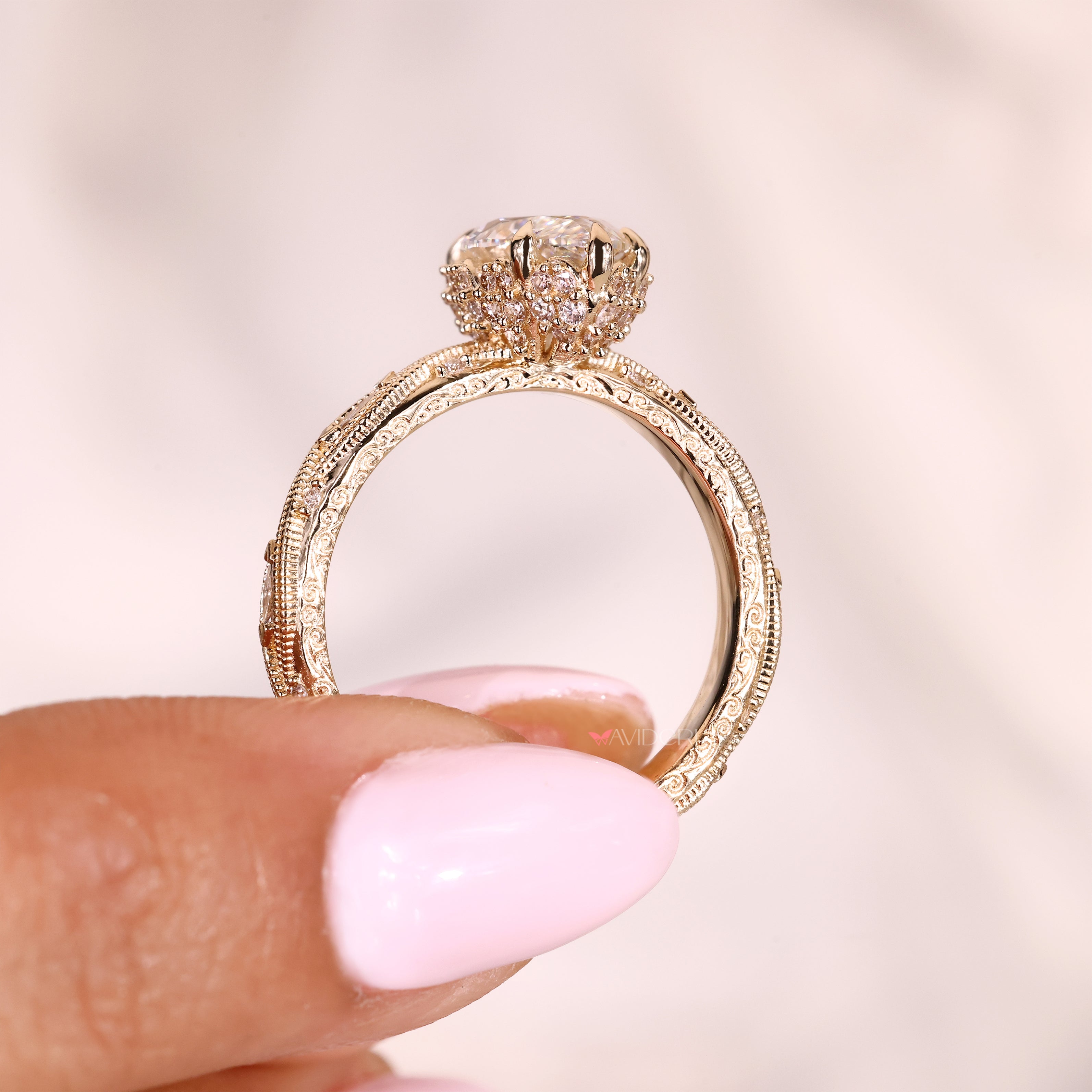 Marquise diamond ring with hidden halo and side stones
