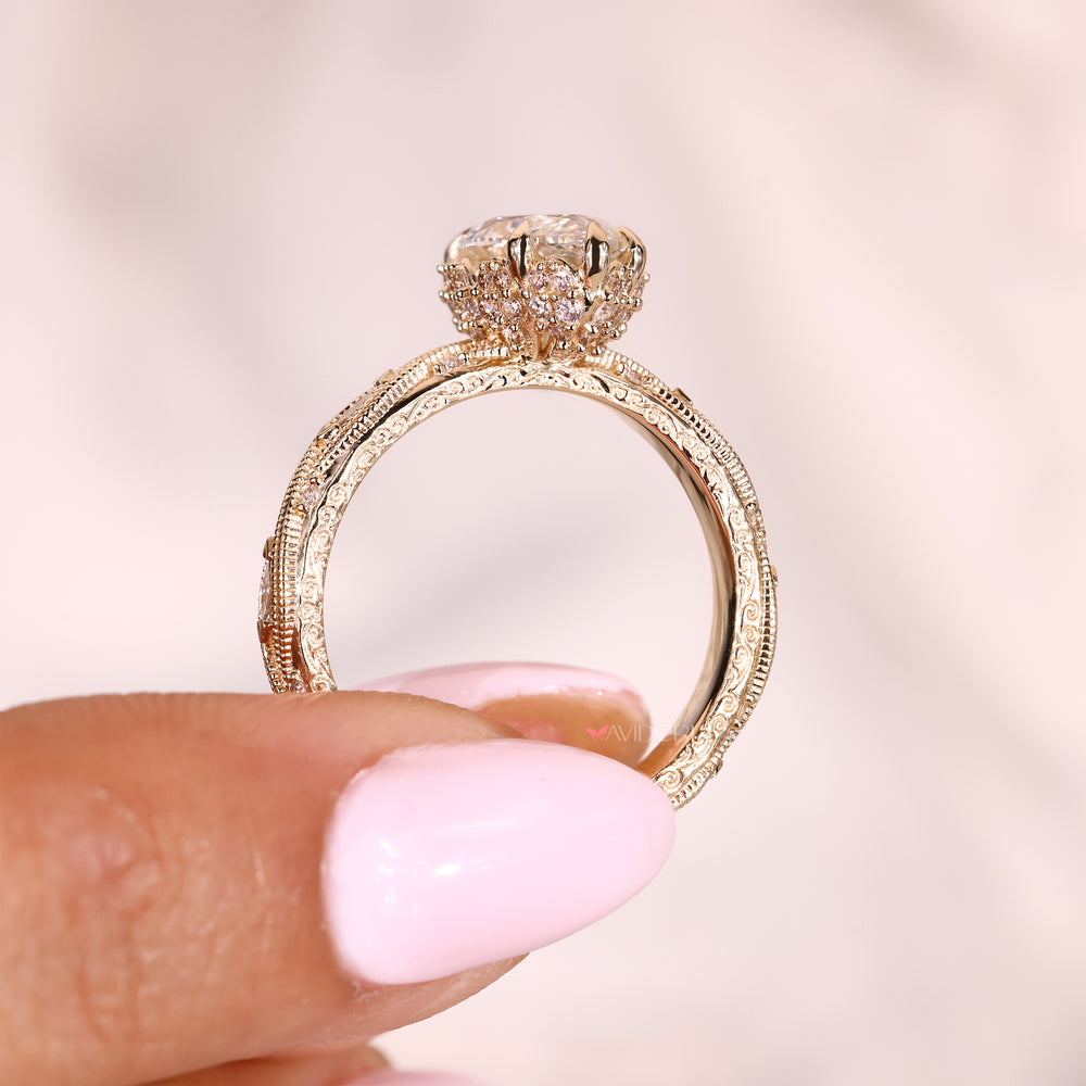 Marquise diamond ring with hidden halo and side stones
