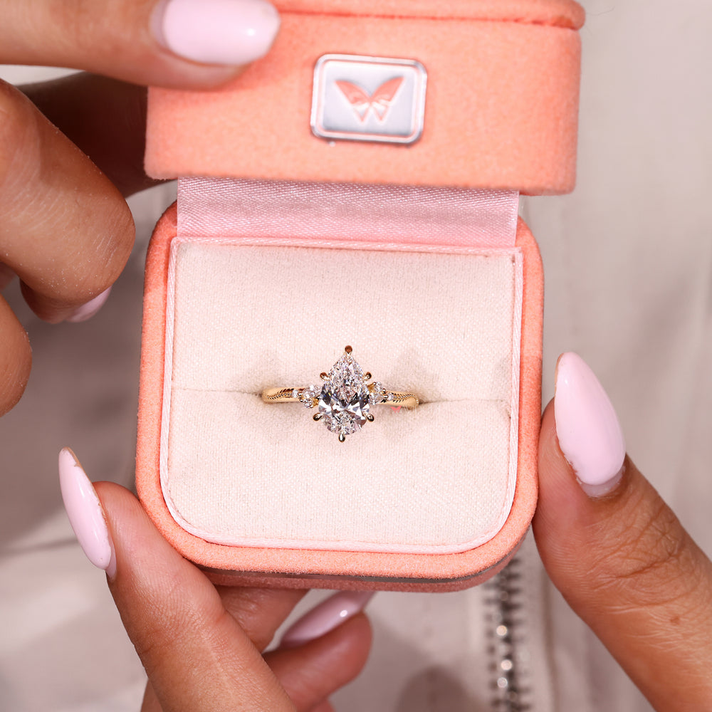 Pear cut lab diamond ring with trellis style setting
