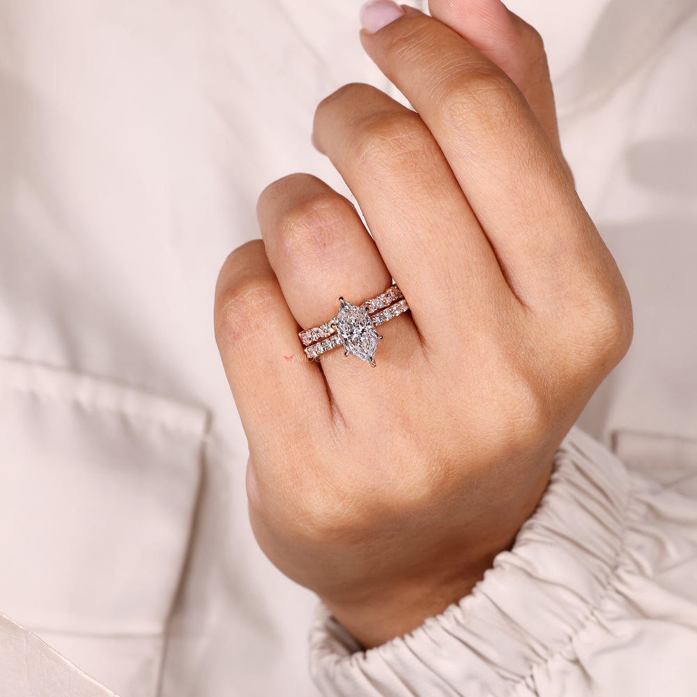 Lab grown marquise ring with halo pave style.
