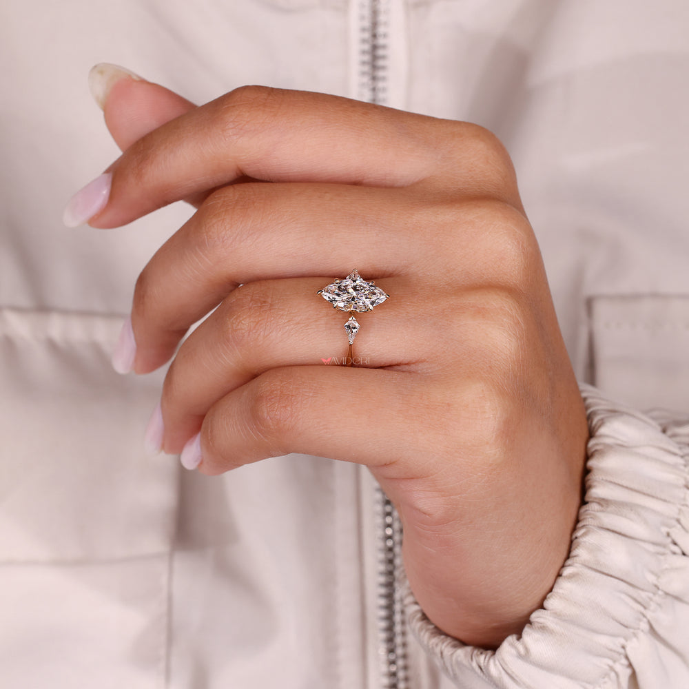 Handmade marquise diamond ring in three stone style.