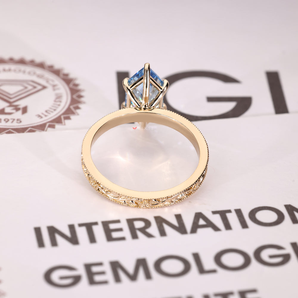 Blue center Dutch marquise diamond ring with solitaire setting
