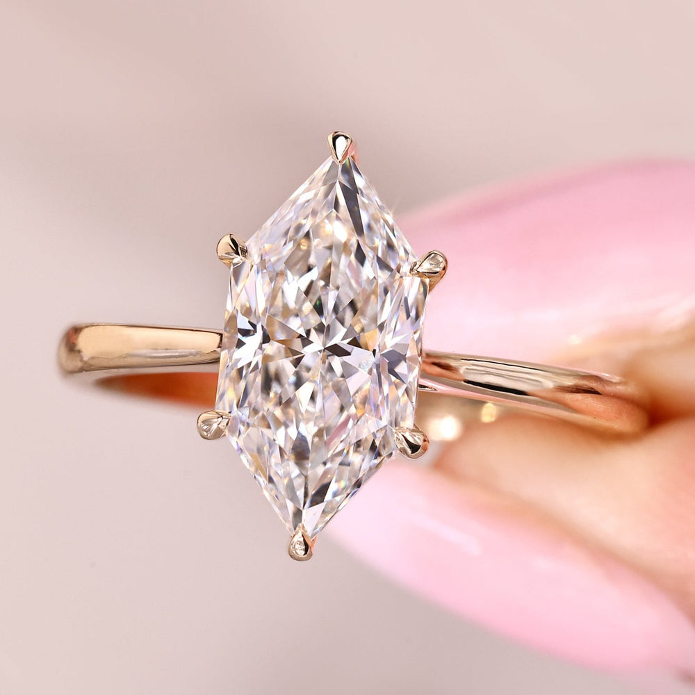 Dutch marquise diamond ring with hidden halo style.
