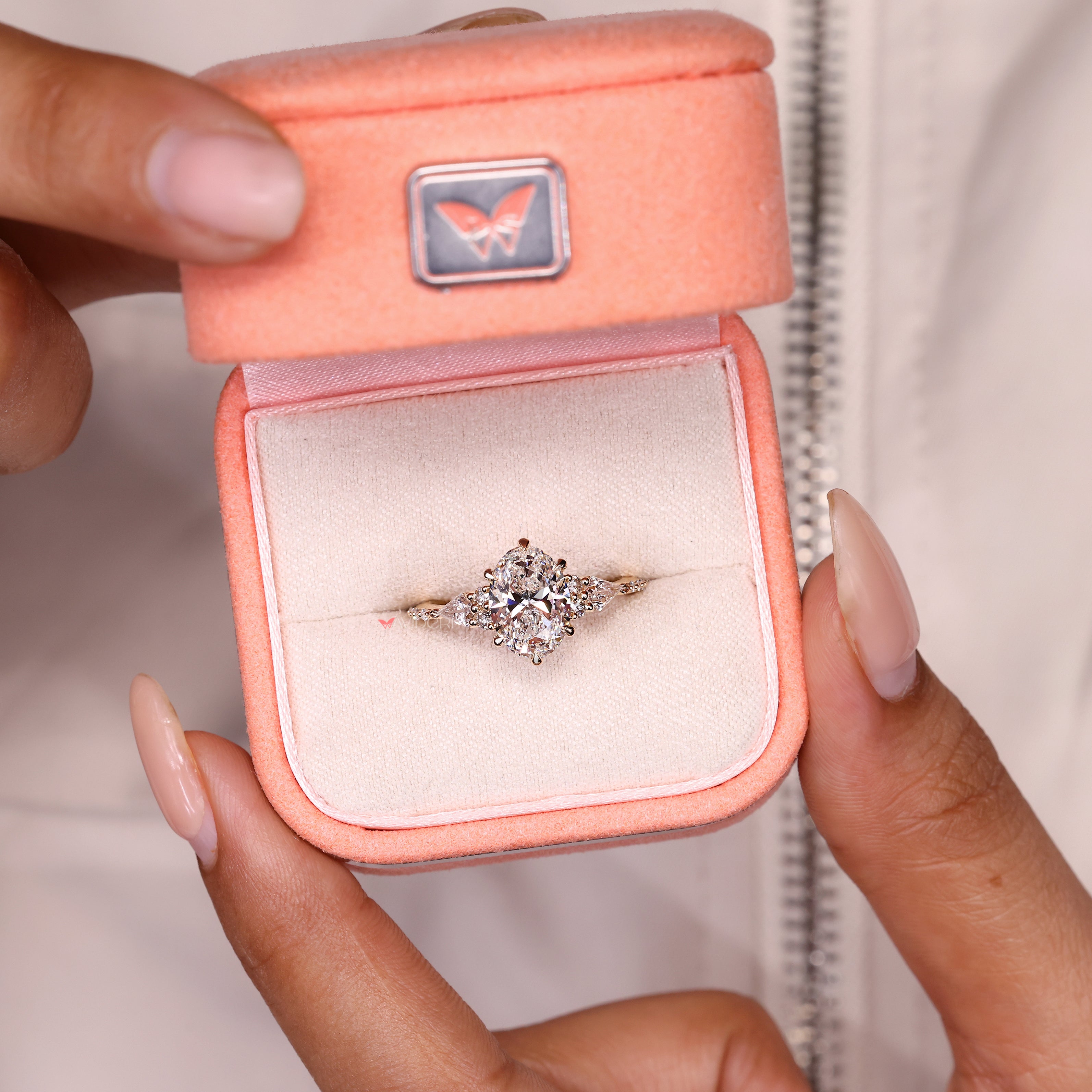 Oval lab grown diamond ring with kite side details
