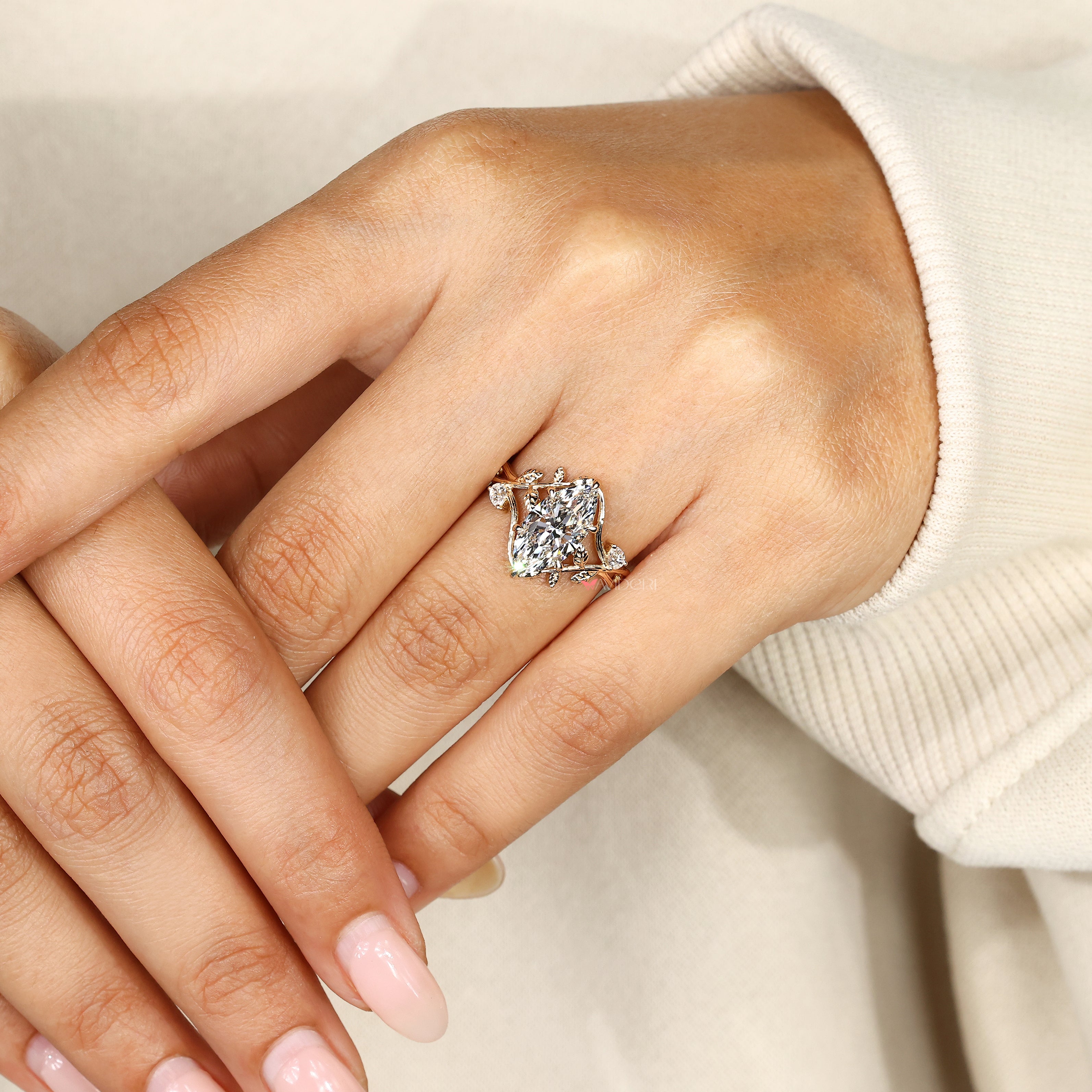 Botanical engagement ring with nature inspired leaf style details
