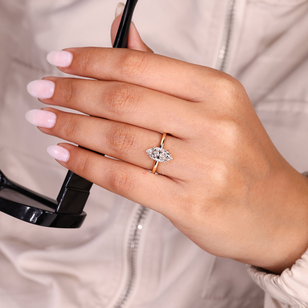 Marquise cut lab grown diamond ring in solitaire style.
