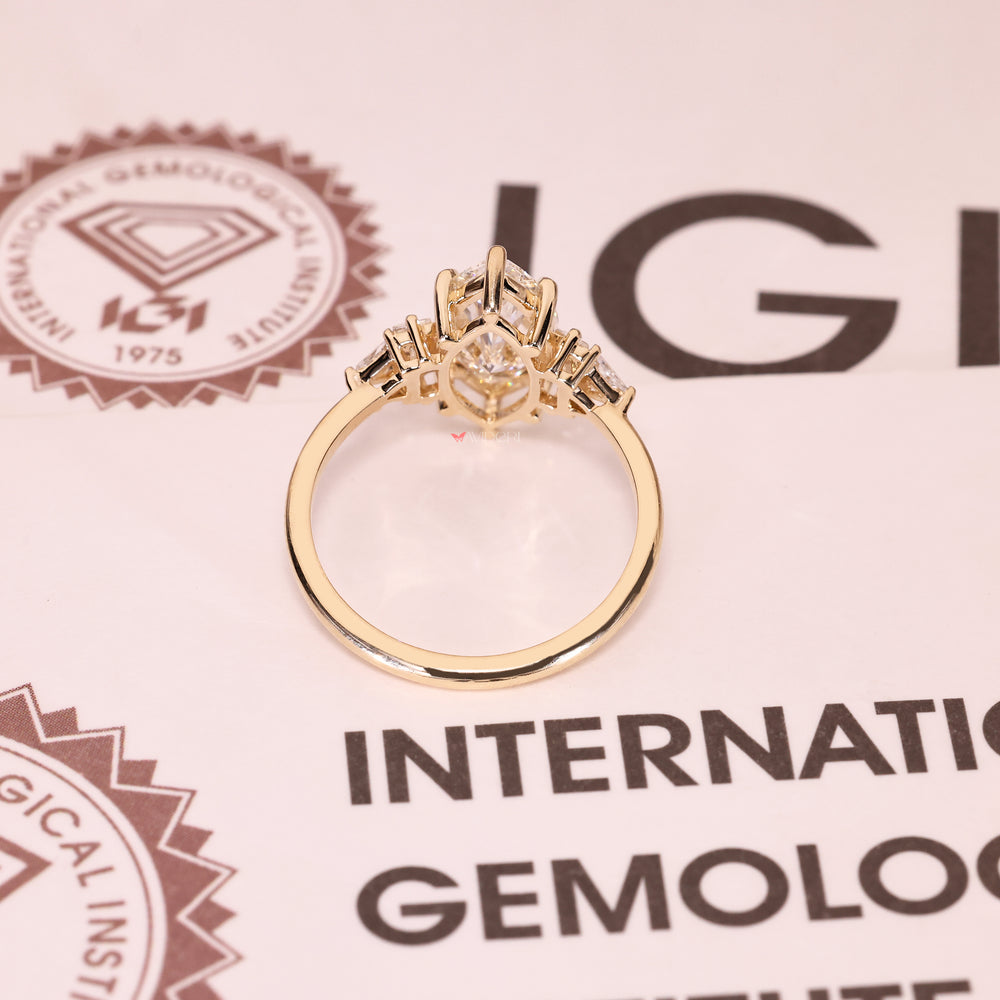Five stone marquise diamond ring with geometric side stones.
