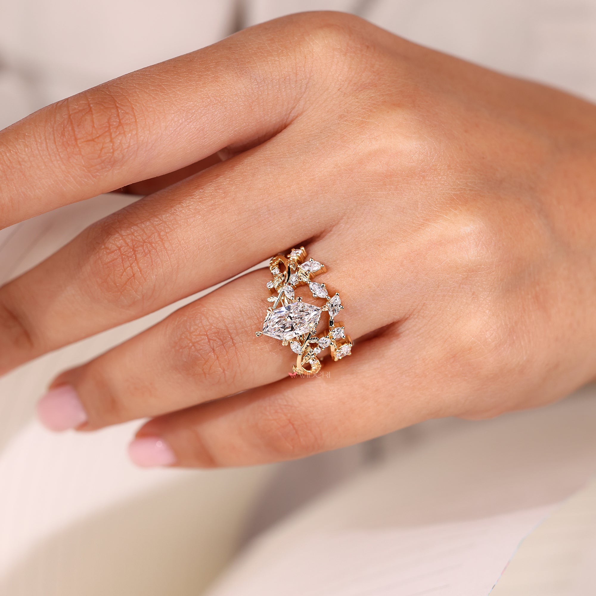 Six leaf style prong marquise engagement ring.