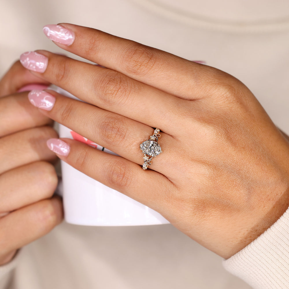 Nature inspired oval ring with open basket setting.
