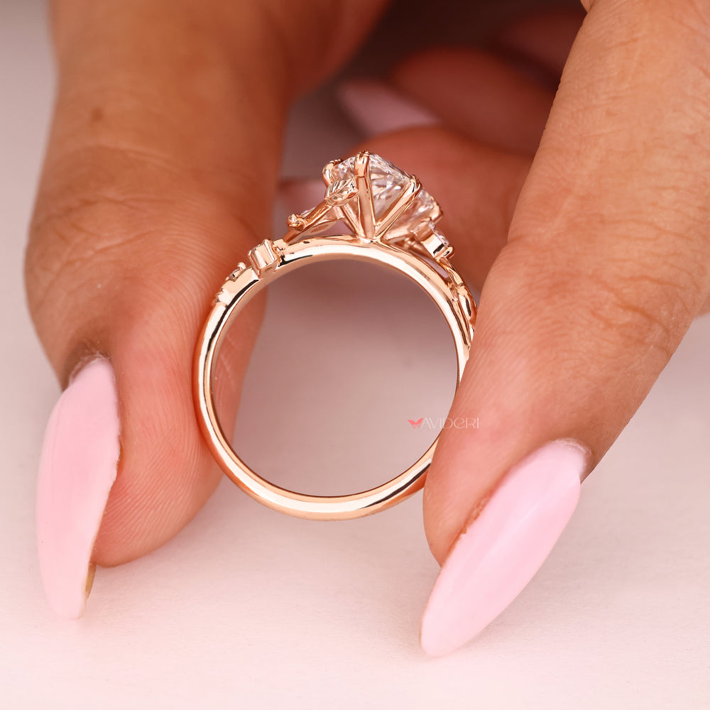 IGI certified pear ring with nature inspired setting details
