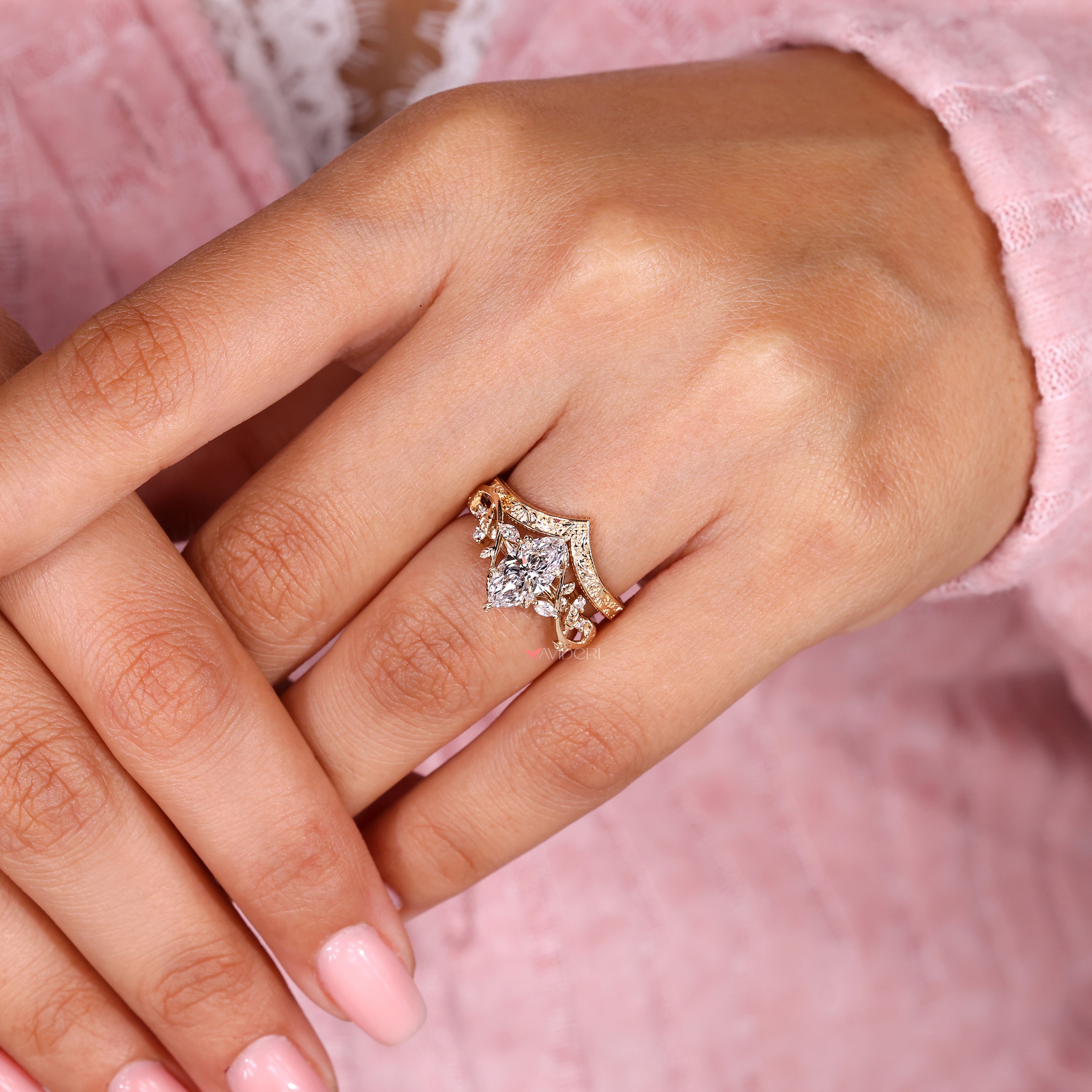 Handmade marquise engagement ring with round side diamonds
