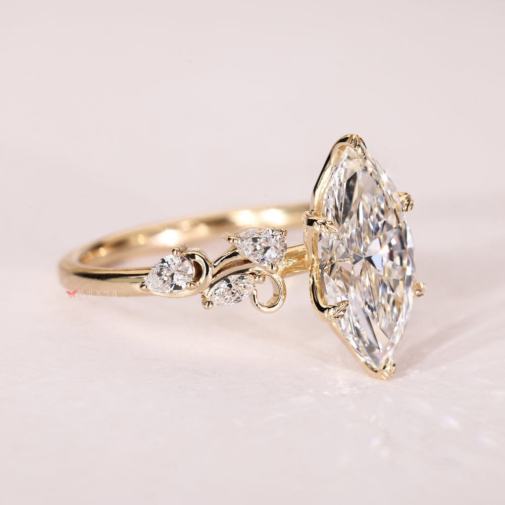 Marquise lab diamond ring with pear accents and tulip setting
