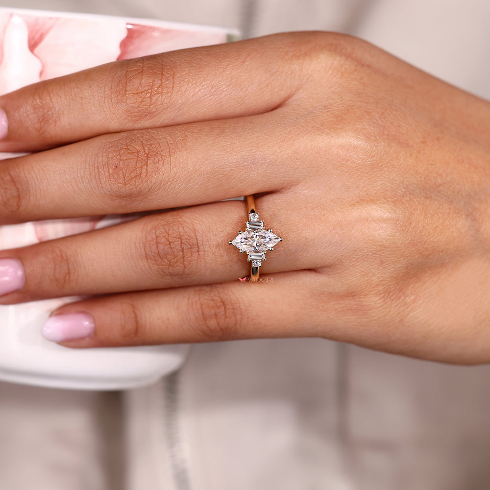 Five stone engagement ring with marquise moissanite center.