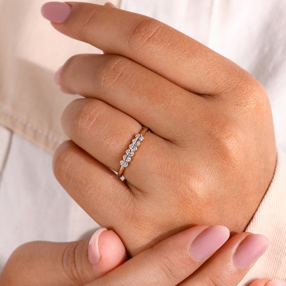 Half eternity wedding band with diamonds around the band.
