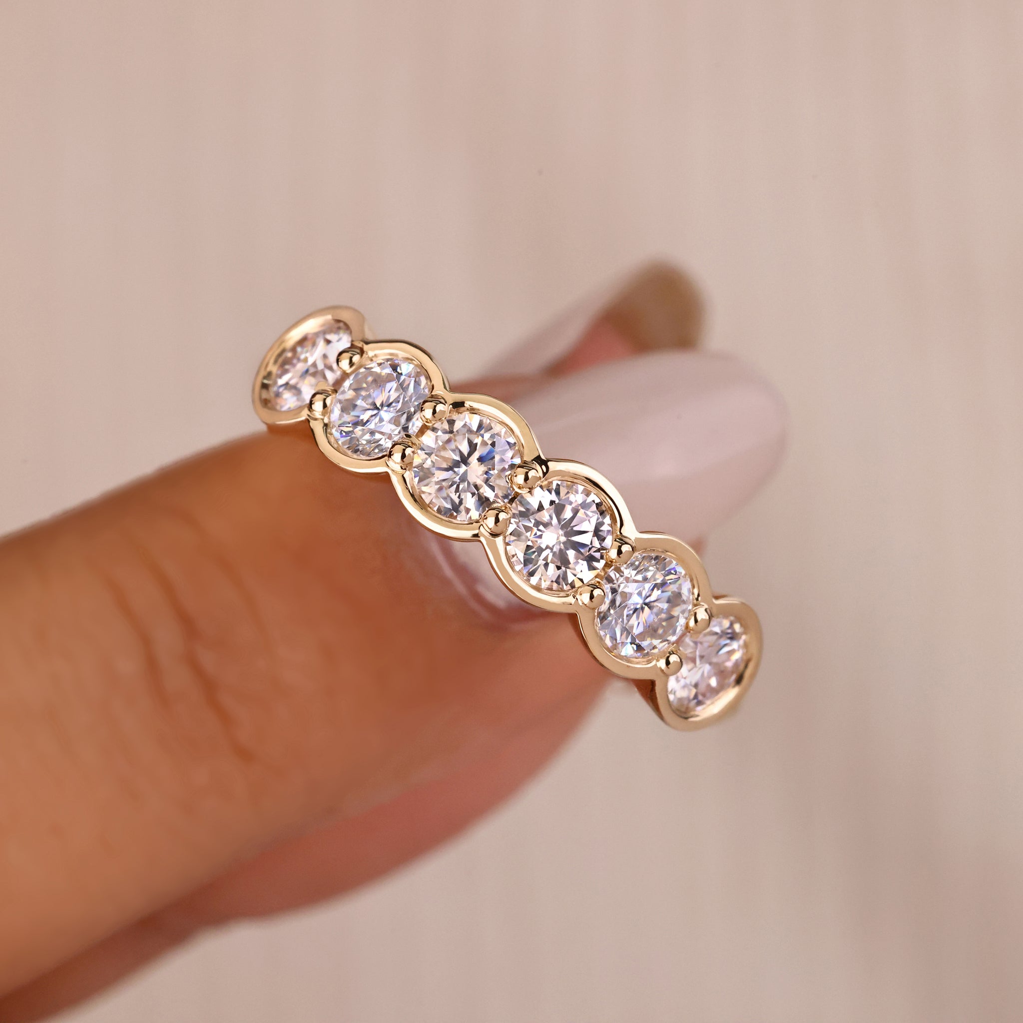 Bezel set wedding band with round lab grown diamonds.
