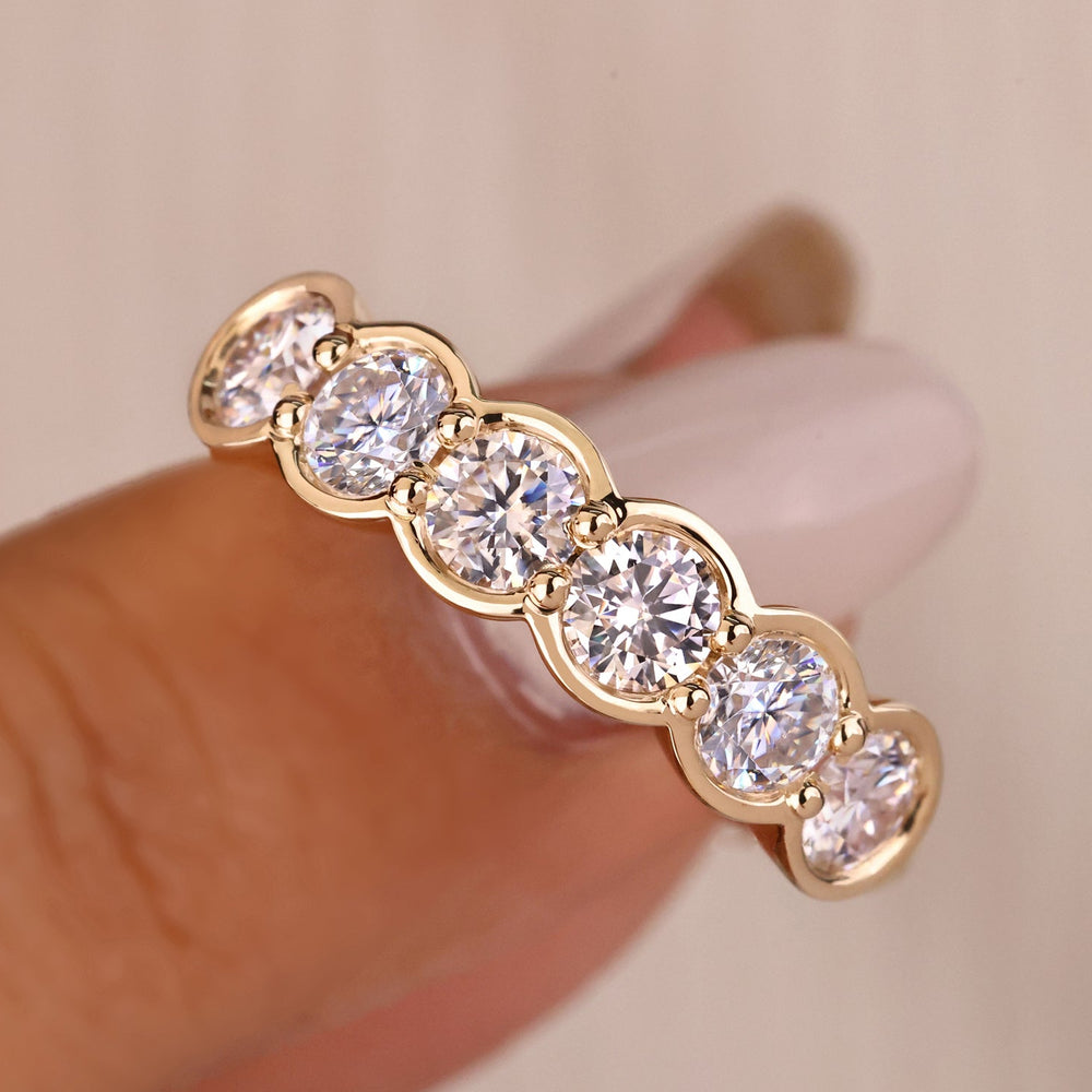 Bezel set wedding band with round lab grown diamonds.
