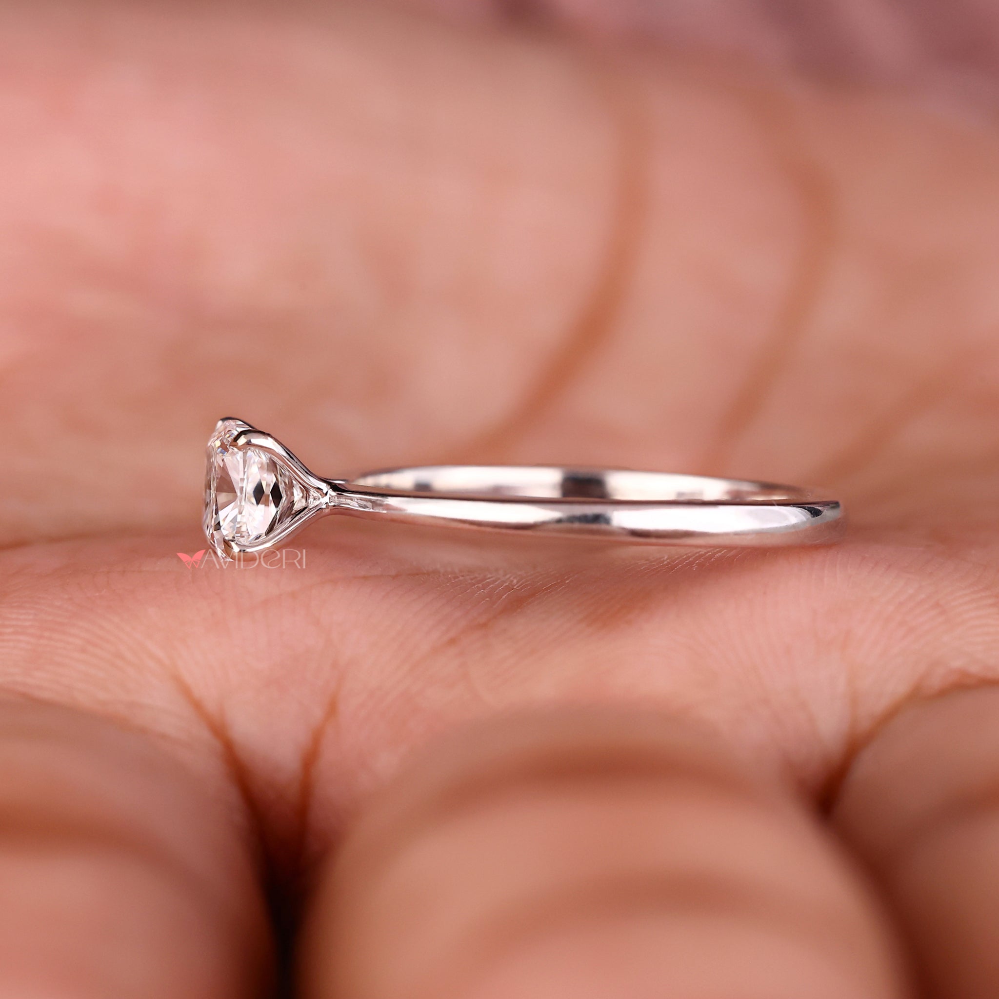 Avideri engagement ring featuring a cushion cut solitaire diamond with lab grown clarity.
