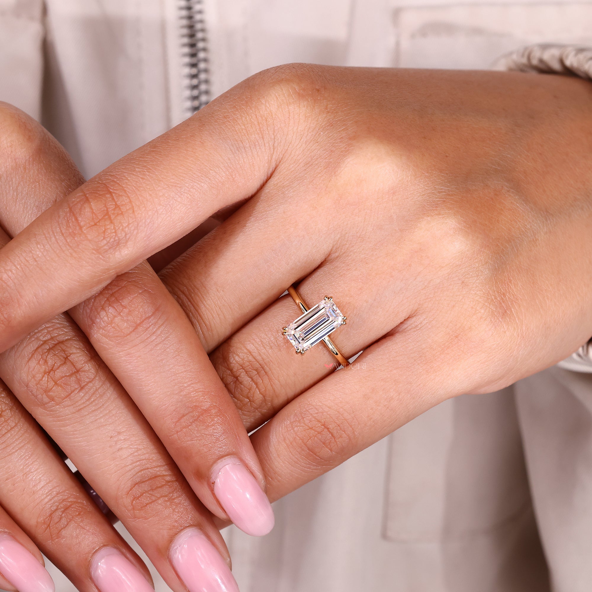 Handmade emerald cut moissanite engagement ring.
