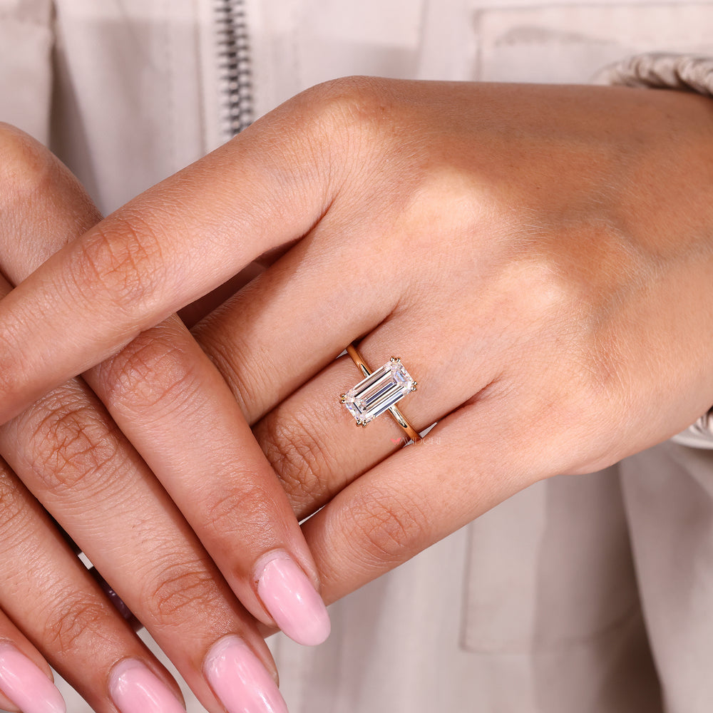 Handmade emerald cut moissanite engagement ring.

