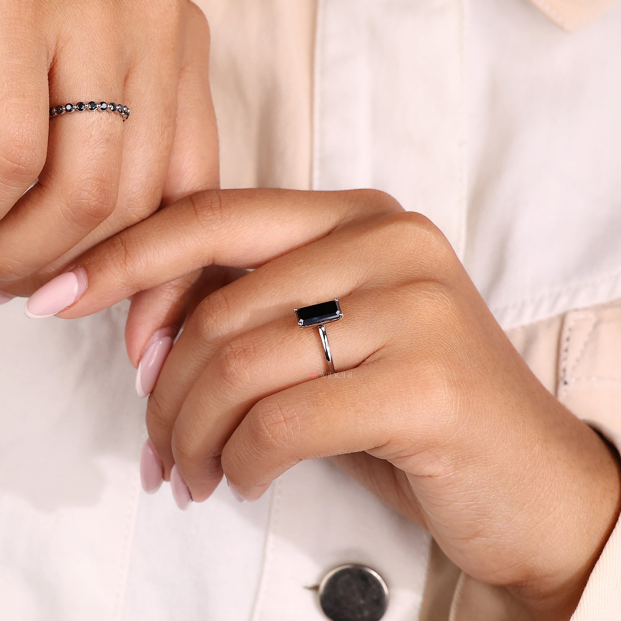 Moissanite gold ring combining simplicity with an emerald portrait style.