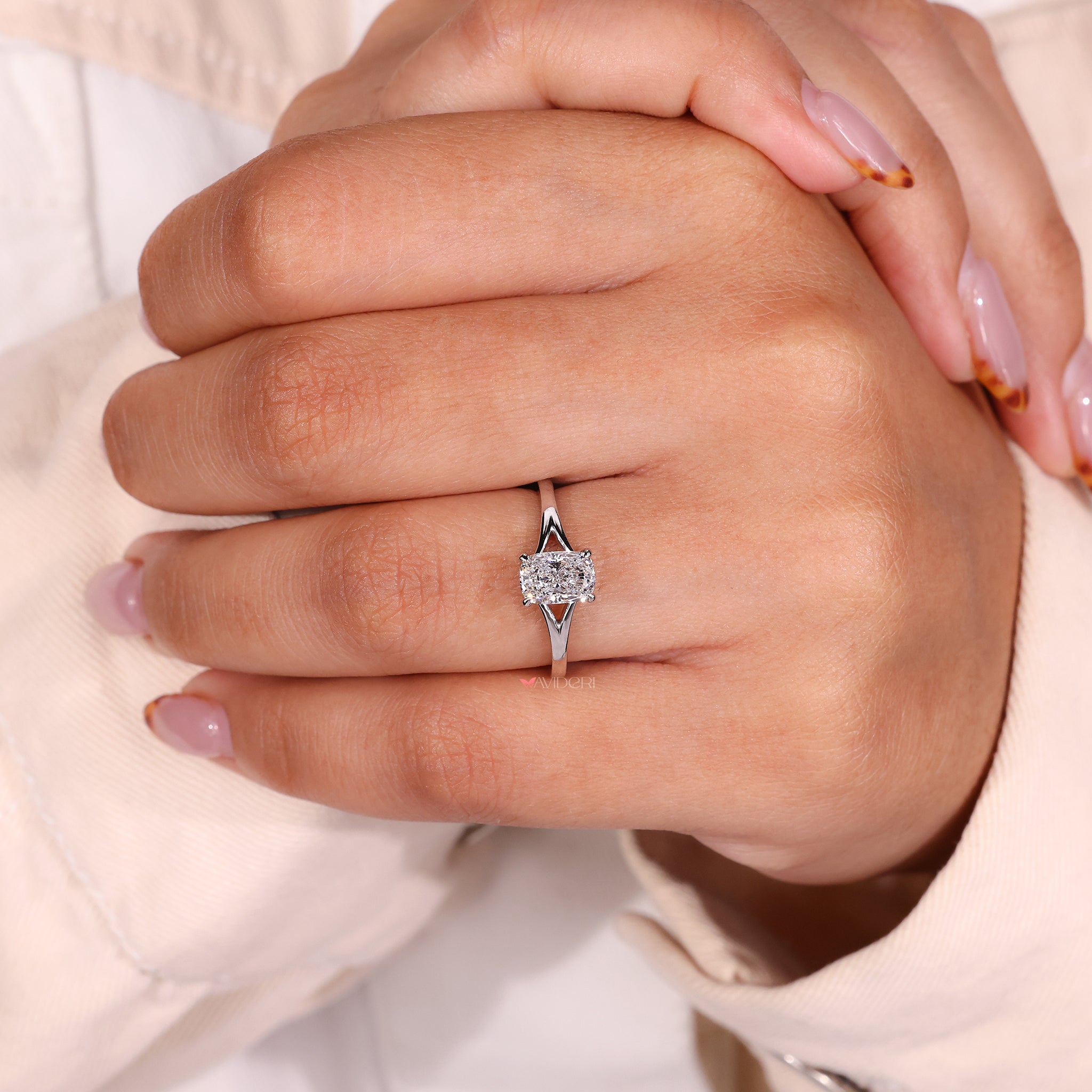 Handmade ring featuring a cushion cut diamond with a solitaire setting.