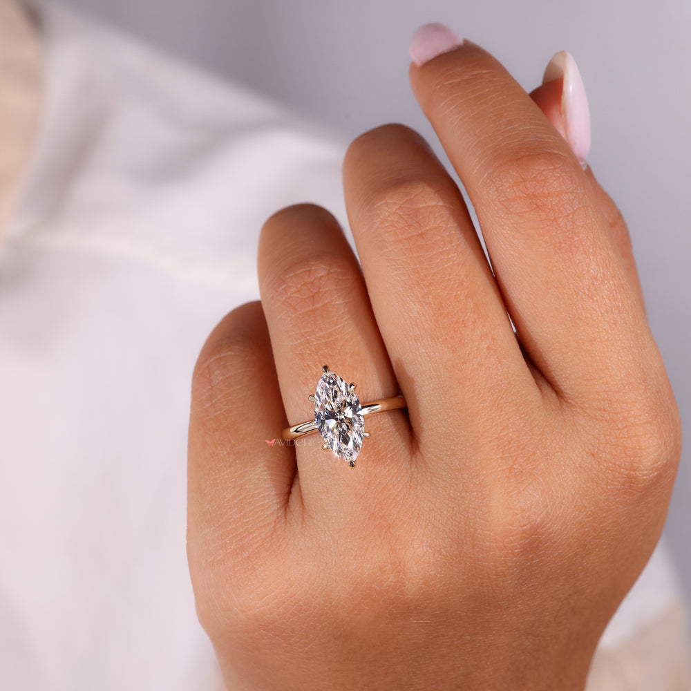 Avideri ring featuring a brilliant Marquise diamond for luxury.
