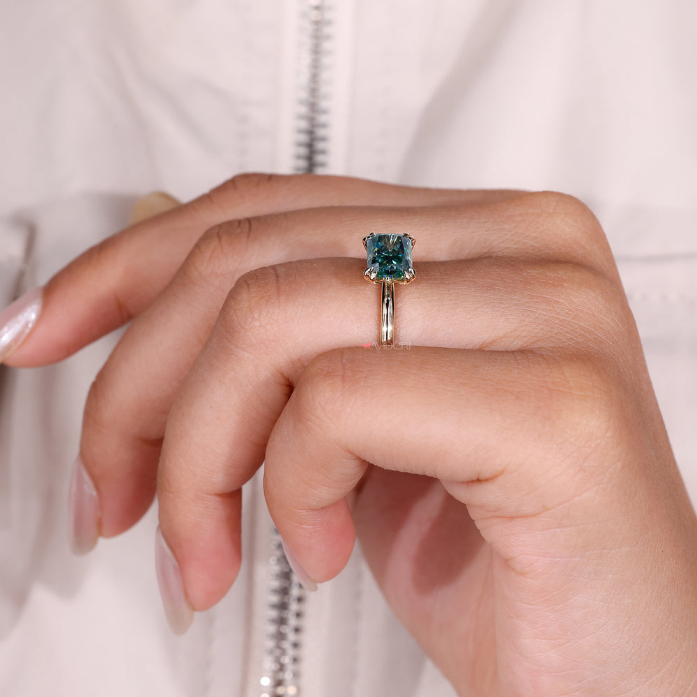 Custom engagement ring with cyan blue moissanite.