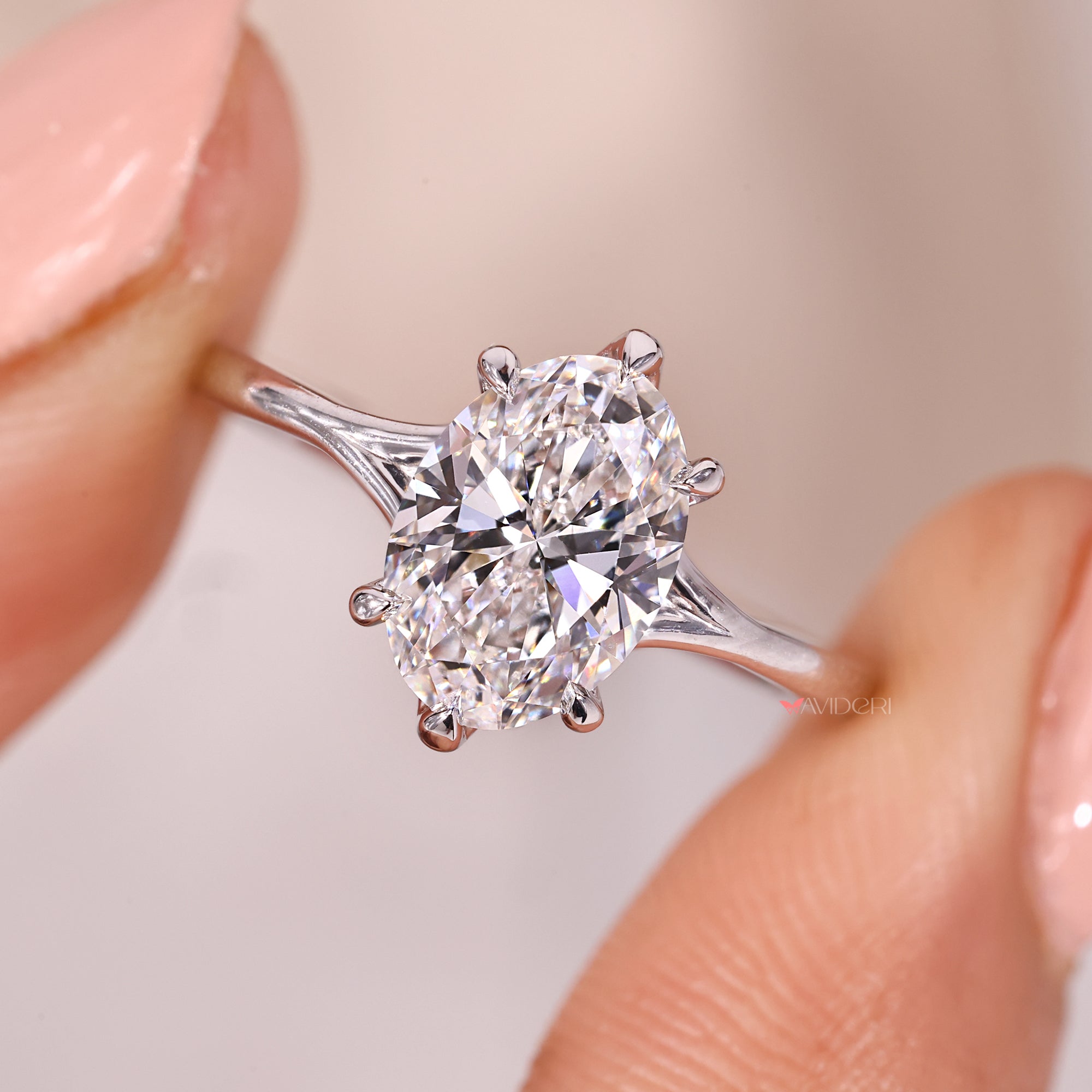 Custom oval engagement ring with handmade split shank band.