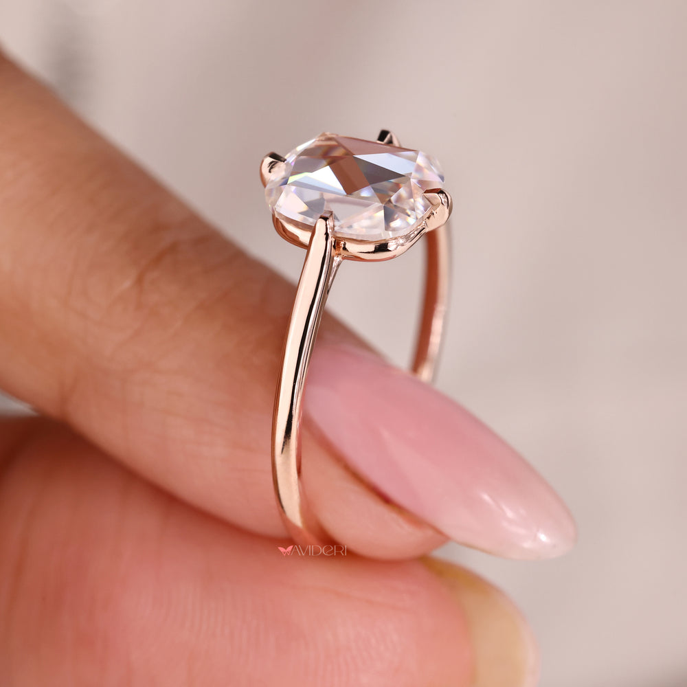 Cushion rose cut moissanite ring set in compass prong for added structure.
